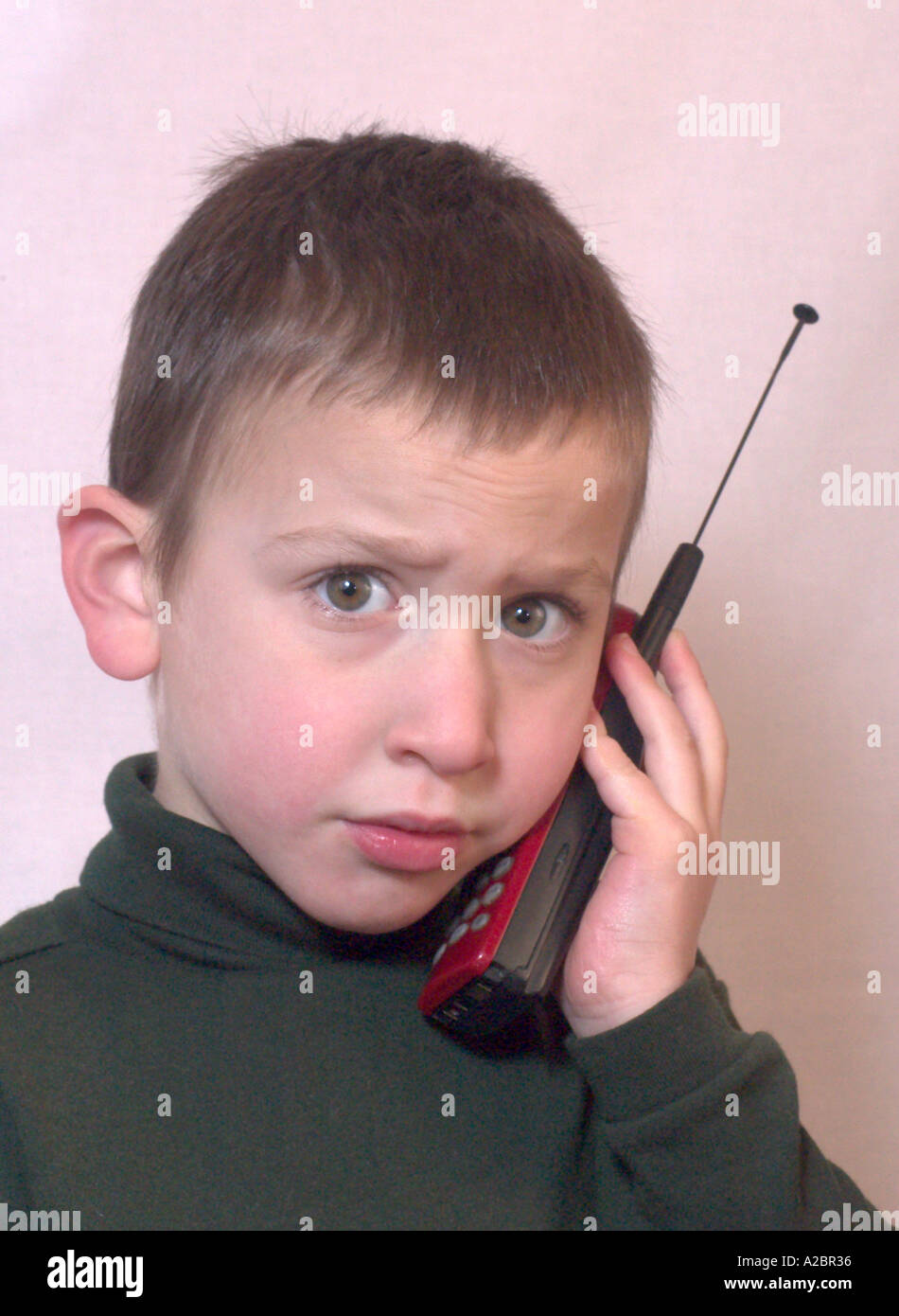 boy using a cell phone Stock Photo