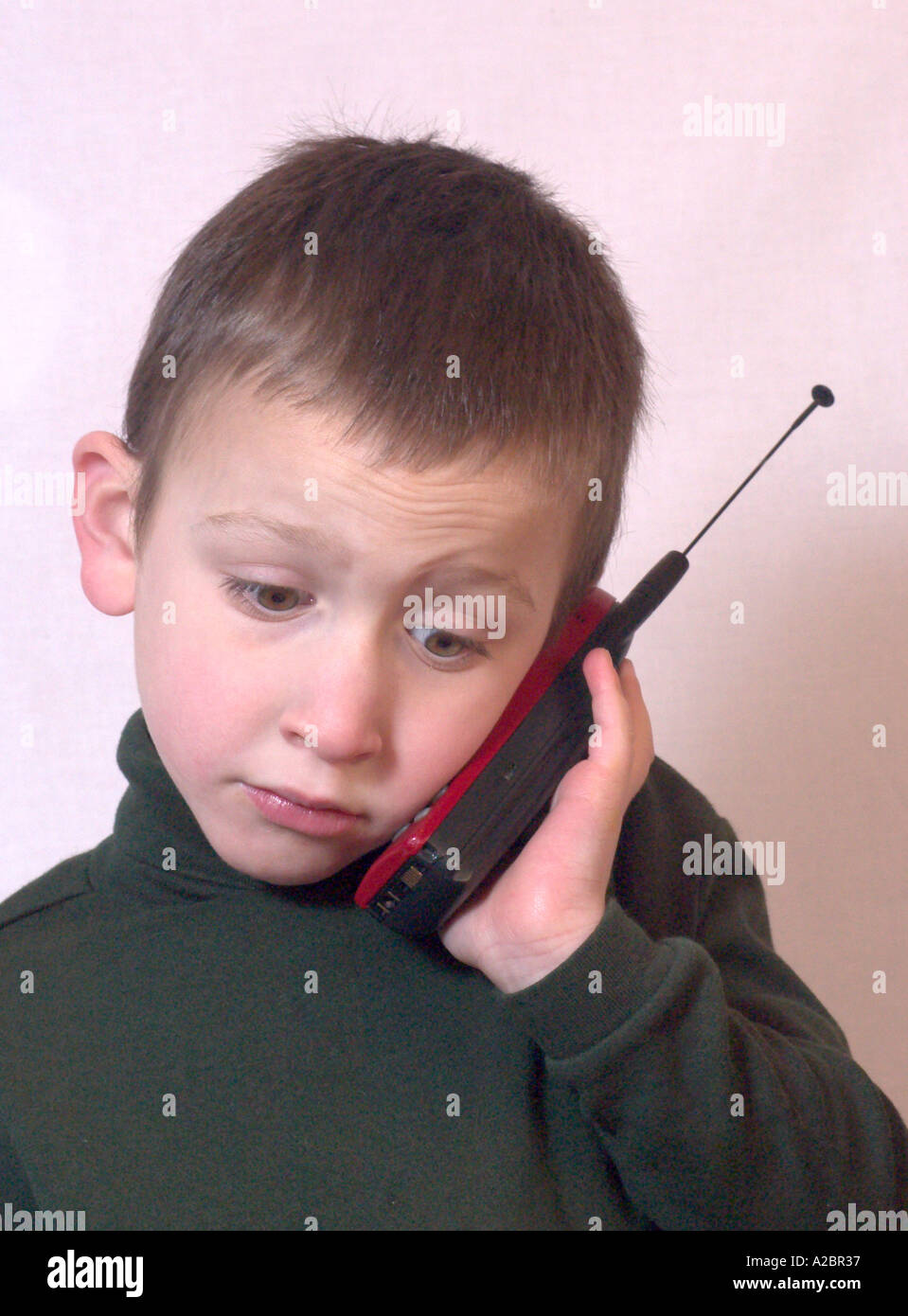 boy using a cell phone Stock Photo