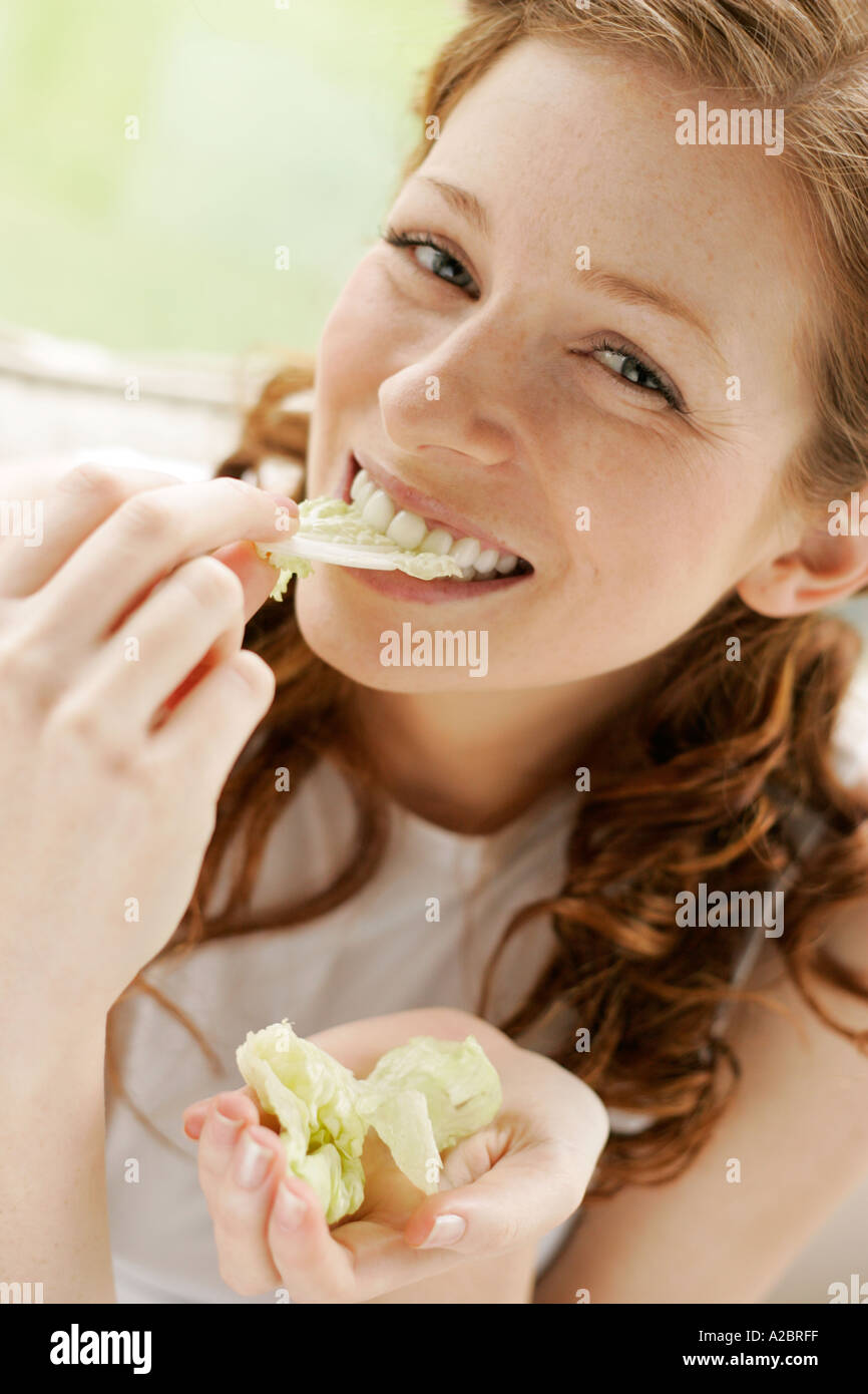 girl eating salad Stock Photo