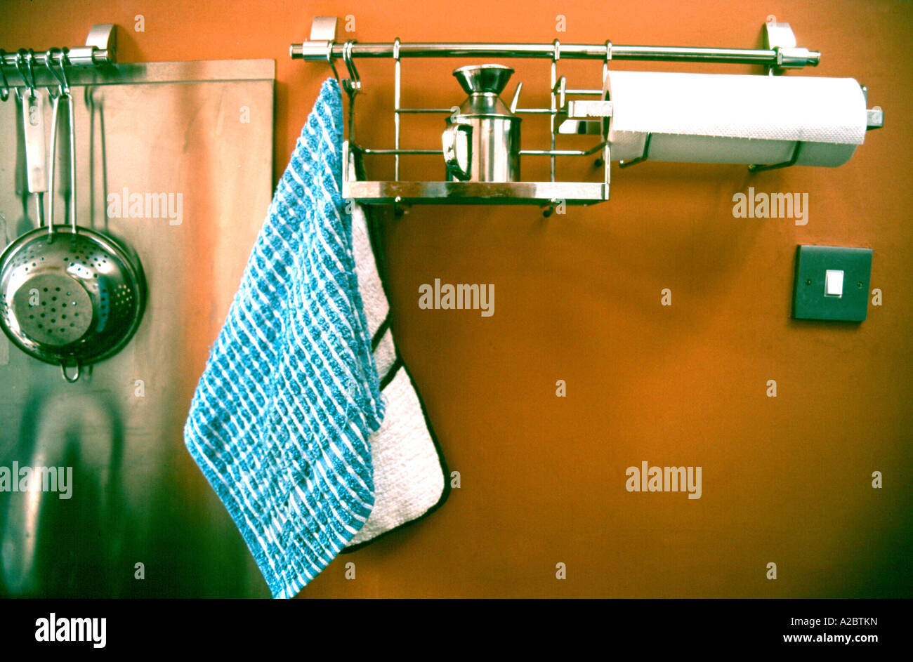 Kitchen utensils on racks Stock Photo - Alamy