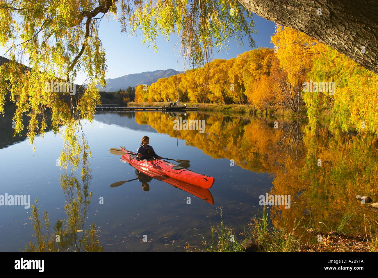 Red Kayak and Autumn Colours Sailors Cutting Lake Benmore Waitaki
