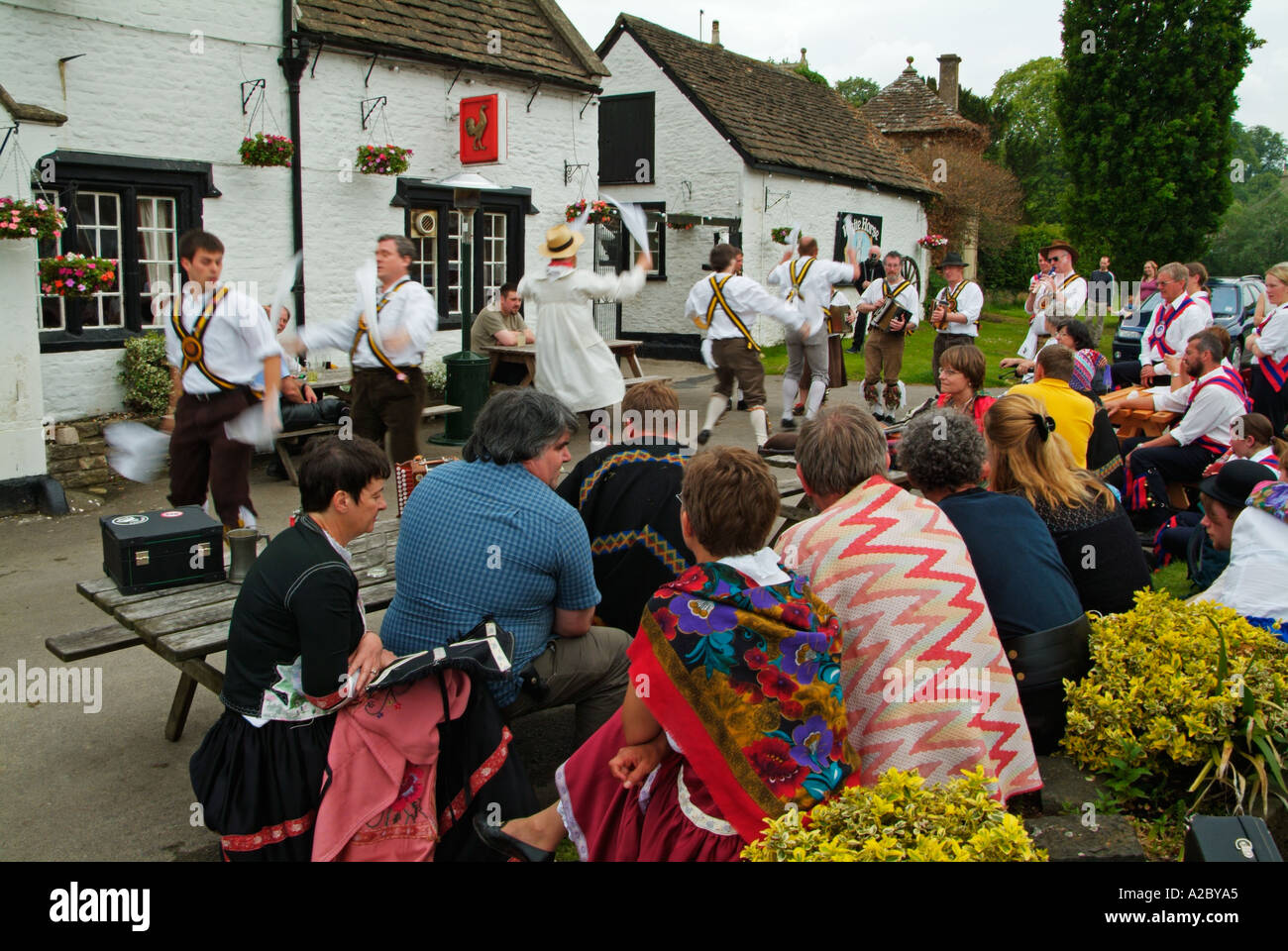 Traditional morris dancing outside an old English pub in Wiltshire
