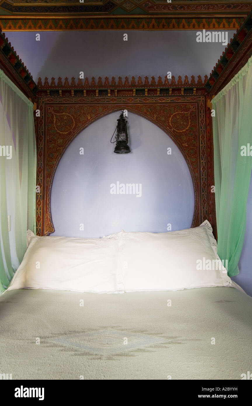 Four poster Bed detail at Casa Hassan restored traditional Moroccan Dar or guesthouse Chefchaouen Morocco Stock Photo