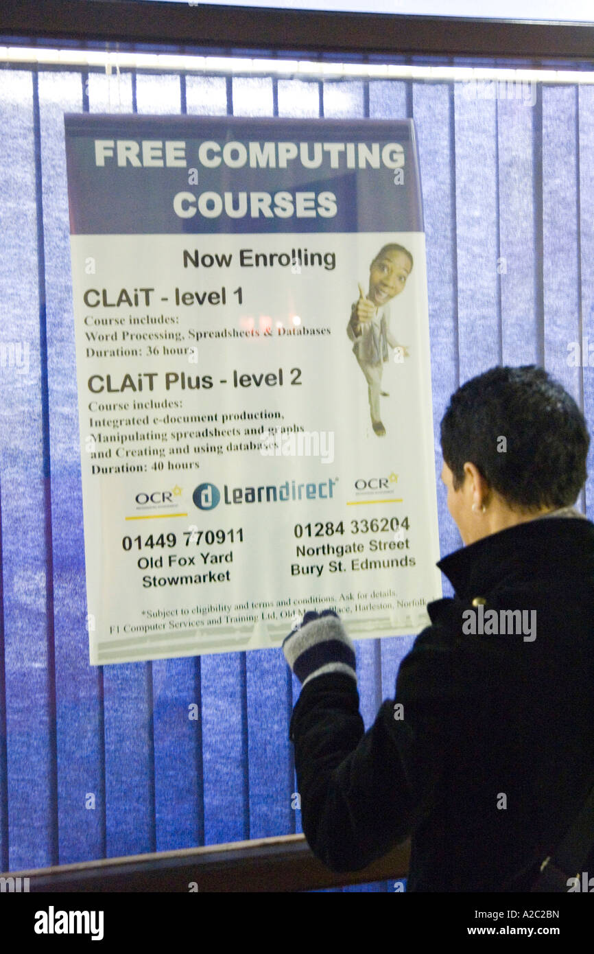 a woman looking through LearnDirect office window for computer training ...