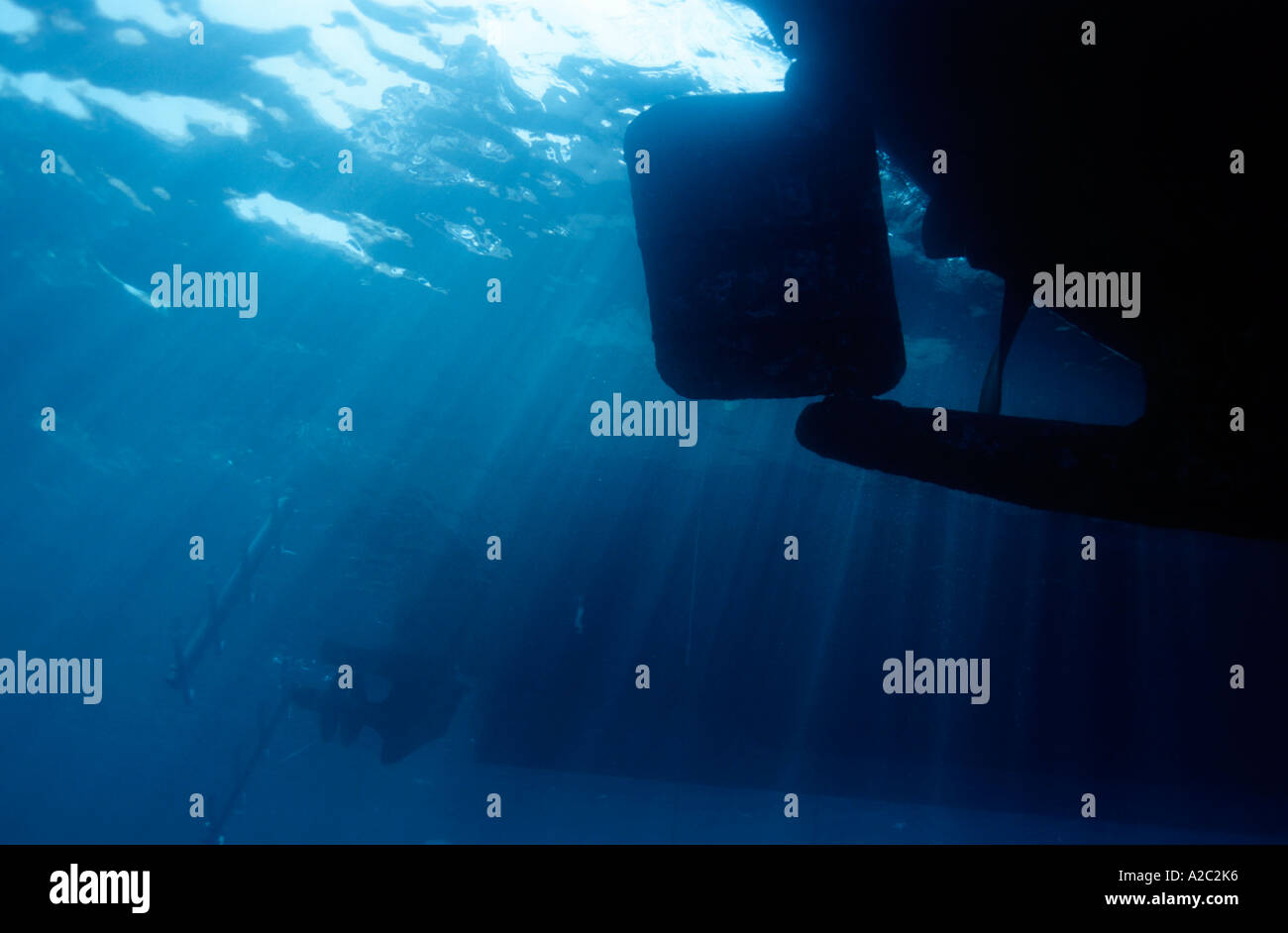 Silhouetted boat's rudder seen from underwater Stock Photo - Alamy