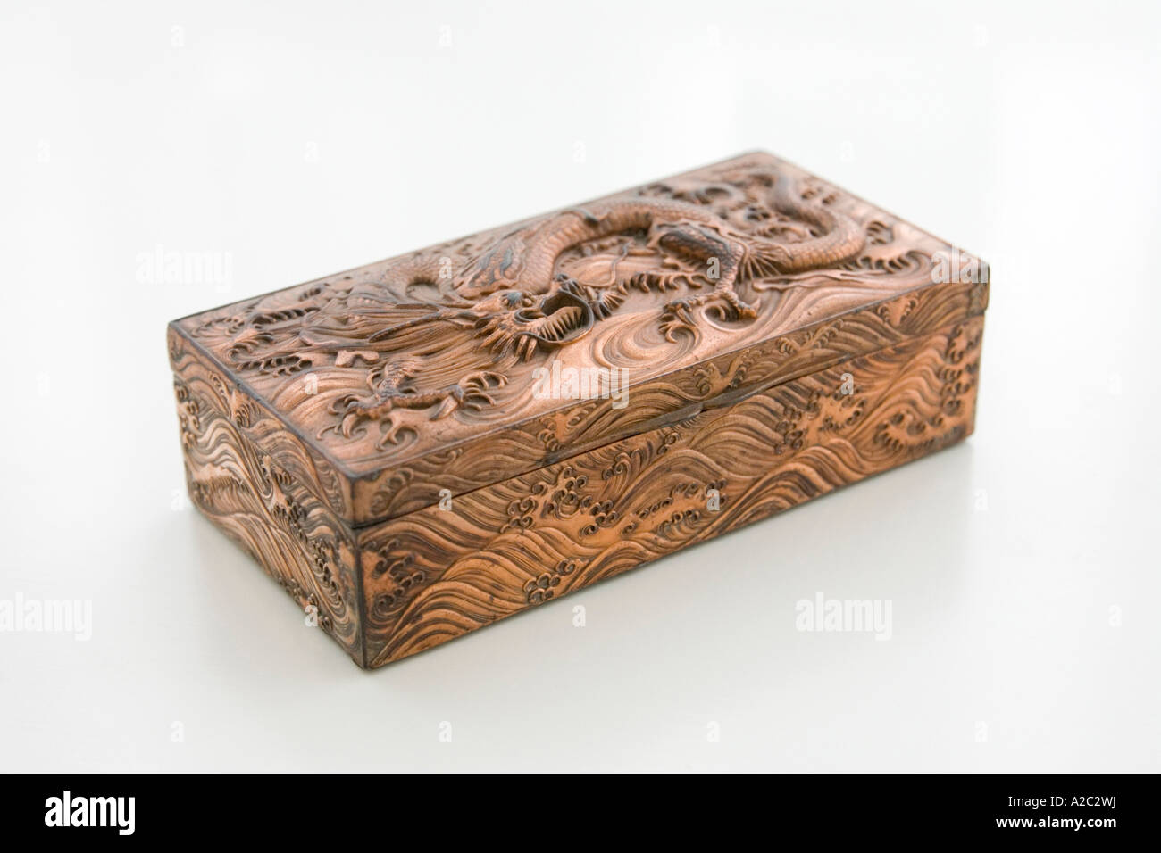 bronze/copper case with carvings of ancient dragon / serpent scene Stock Photo