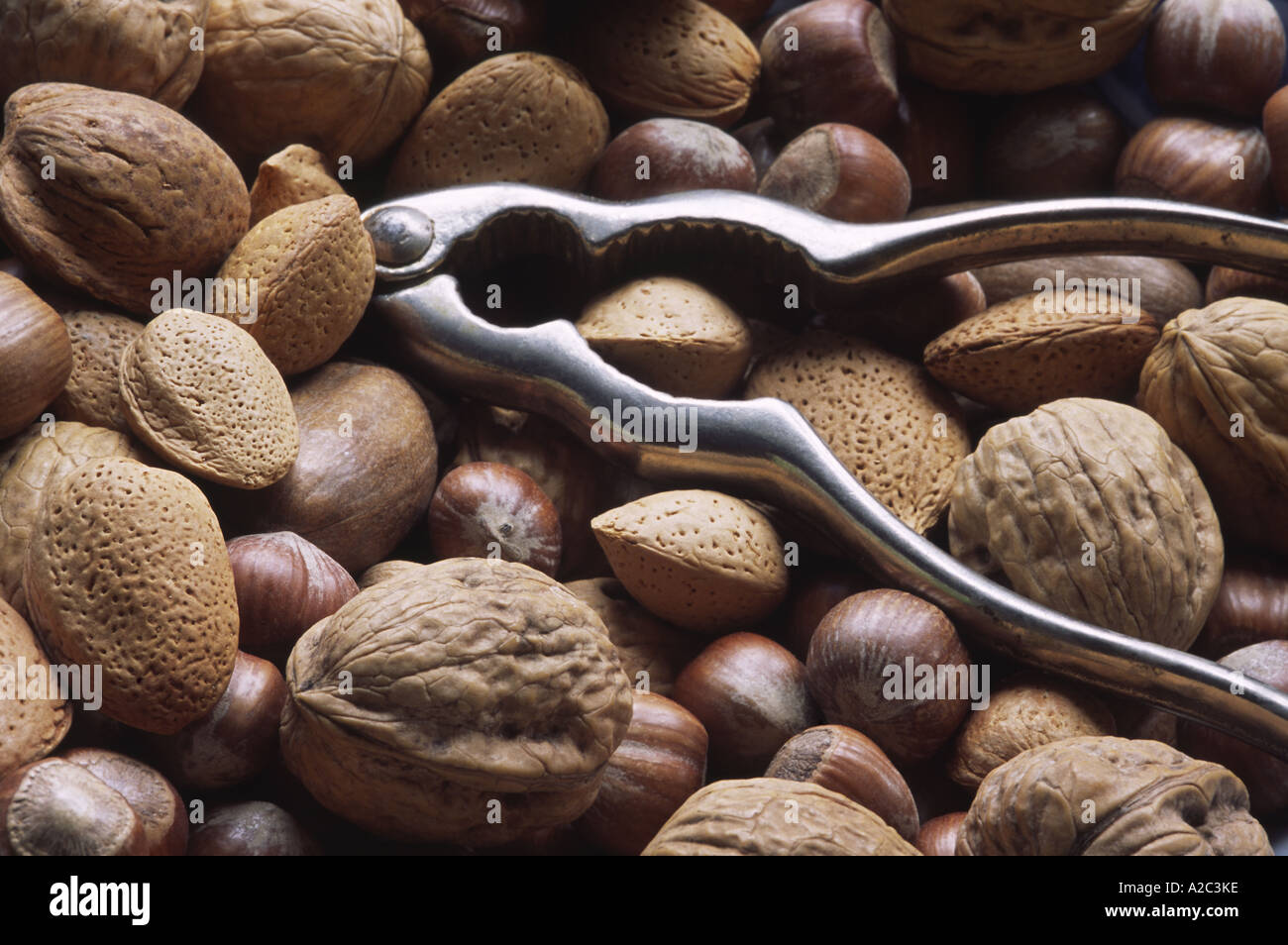 Selection of nuts with metal nutcrackers Stock Photo Alamy