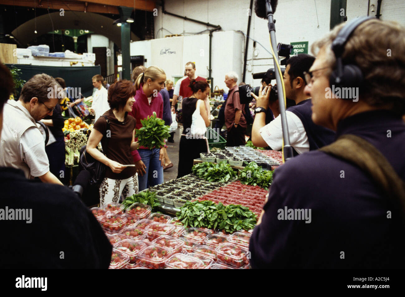 Harumi Kurihara, celebrity chef and Japanese television film  crew at Borough Market London 2005 Stock Photo