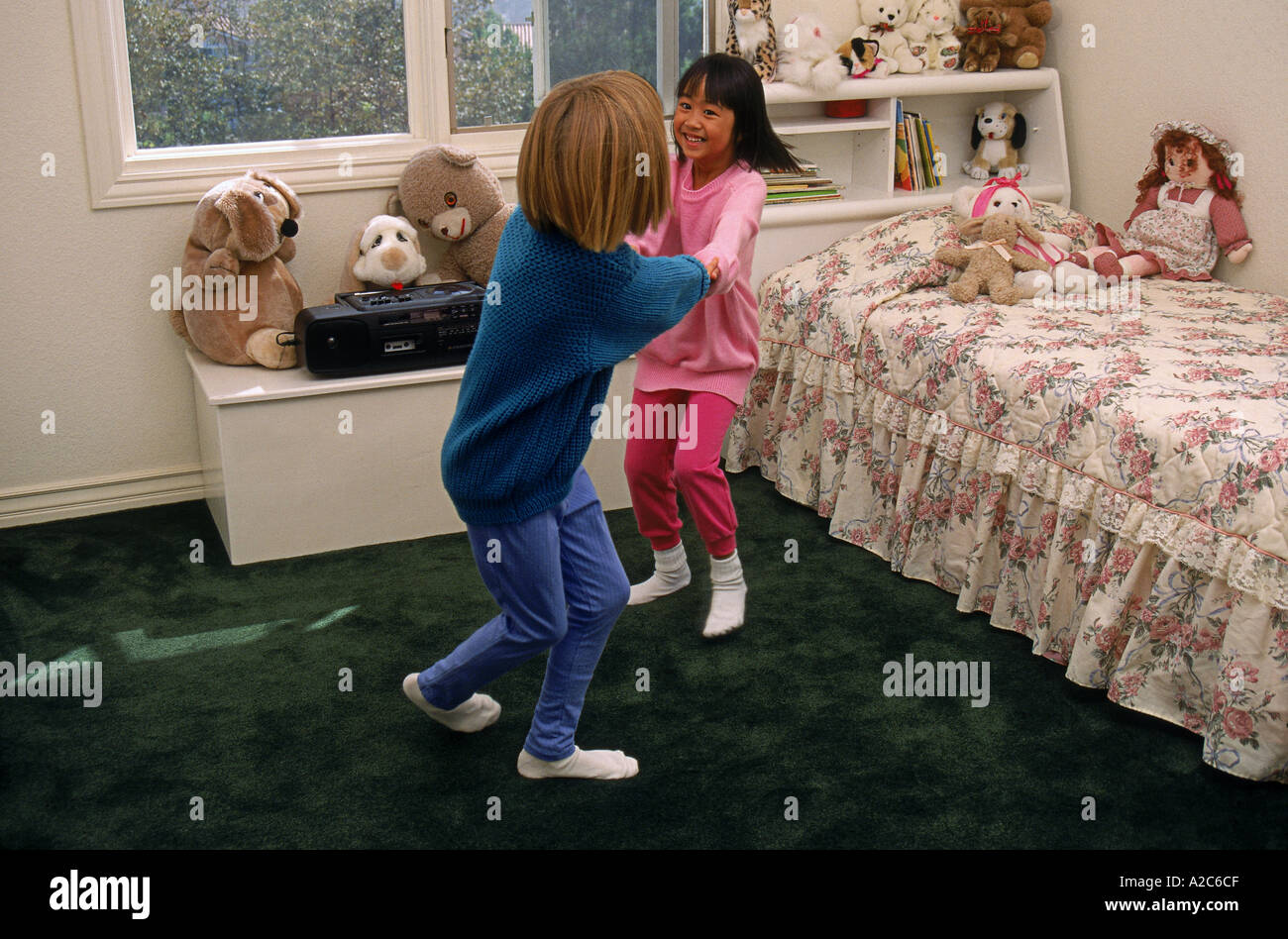 Two young girls  6-7 dancing playing play in bedroom  vintage Boombox   MR  © Myrleen Pearson Stock Photo