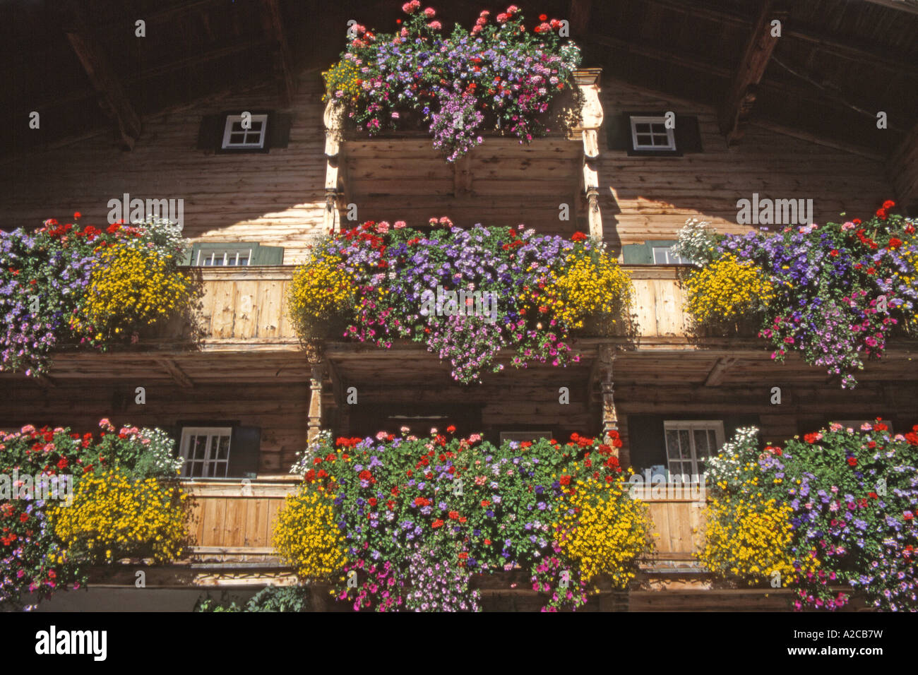 Well-filled flower boxes decorate a house in the village of Aurach, Tyrol Stock Photo
