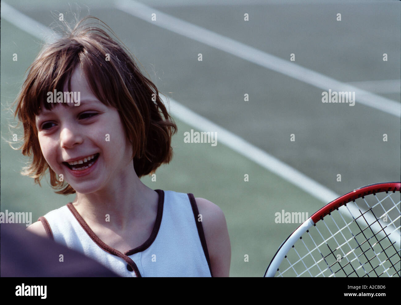 Children s Tennis Lesson seven year old girl Stock Photo Alamy