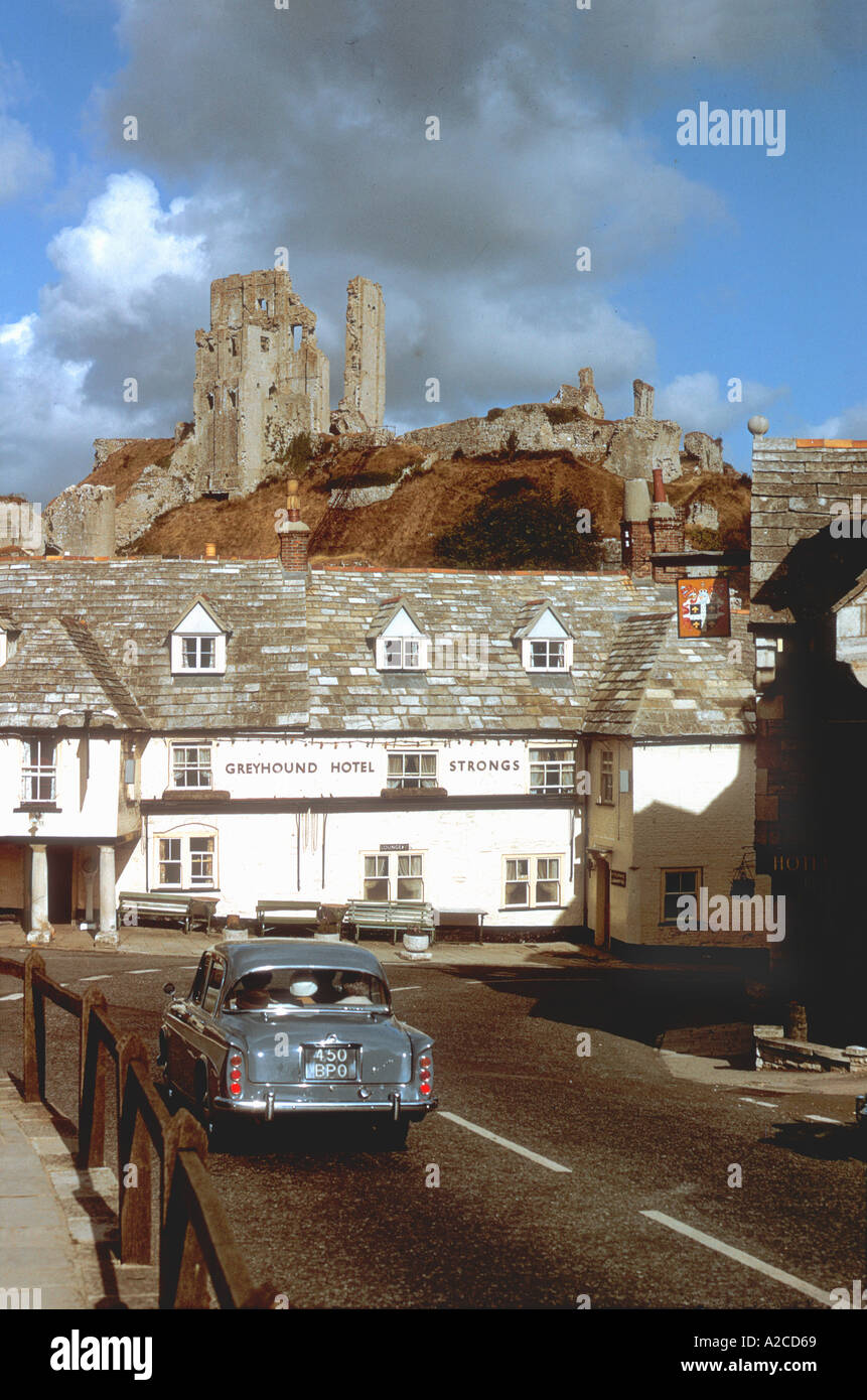 Vintage 1965 Corfe Castle England with a car foreground Stock Photo