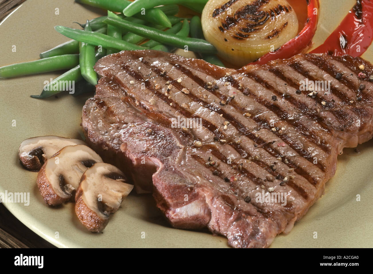 T bone steak fried onions hi-res stock photography and images - Alamy