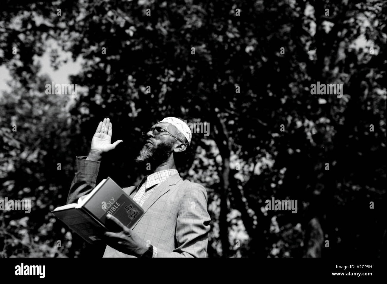 Muslim man reading from the Holy Bible at Speakers' Corner, Hyde Park