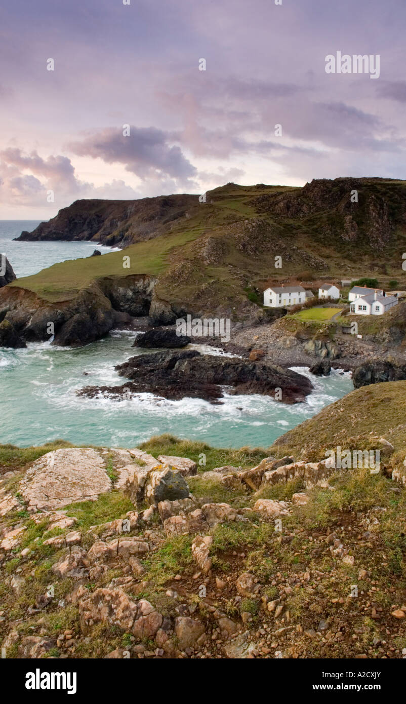 Kynance Cove Cornwall UK at dusk with the beautiful turquoise water that this cove is famous for Stock Photo