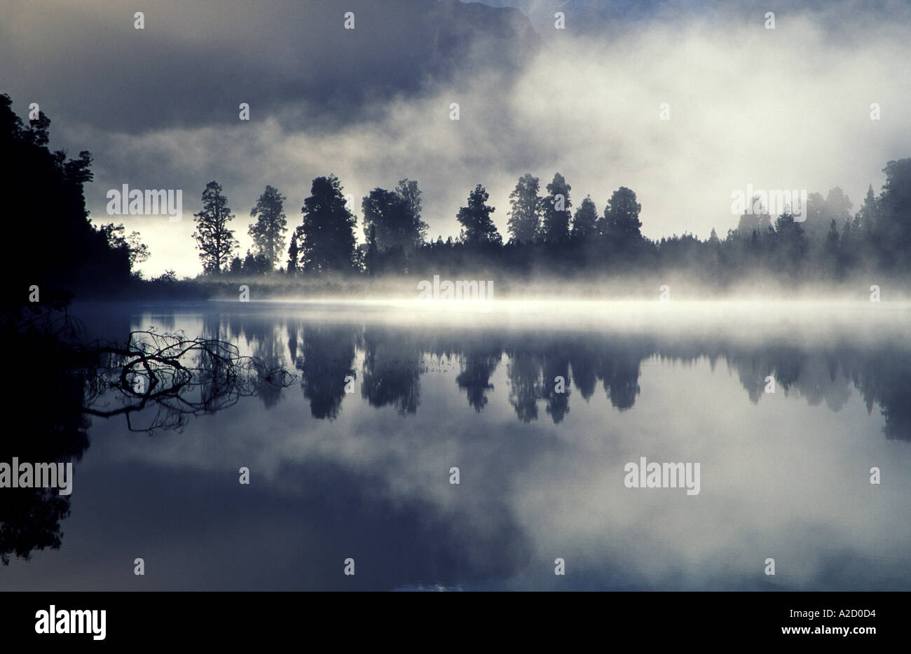Misty Dawn at Lake Matheson in New Zealand Stock Photo - Alamy