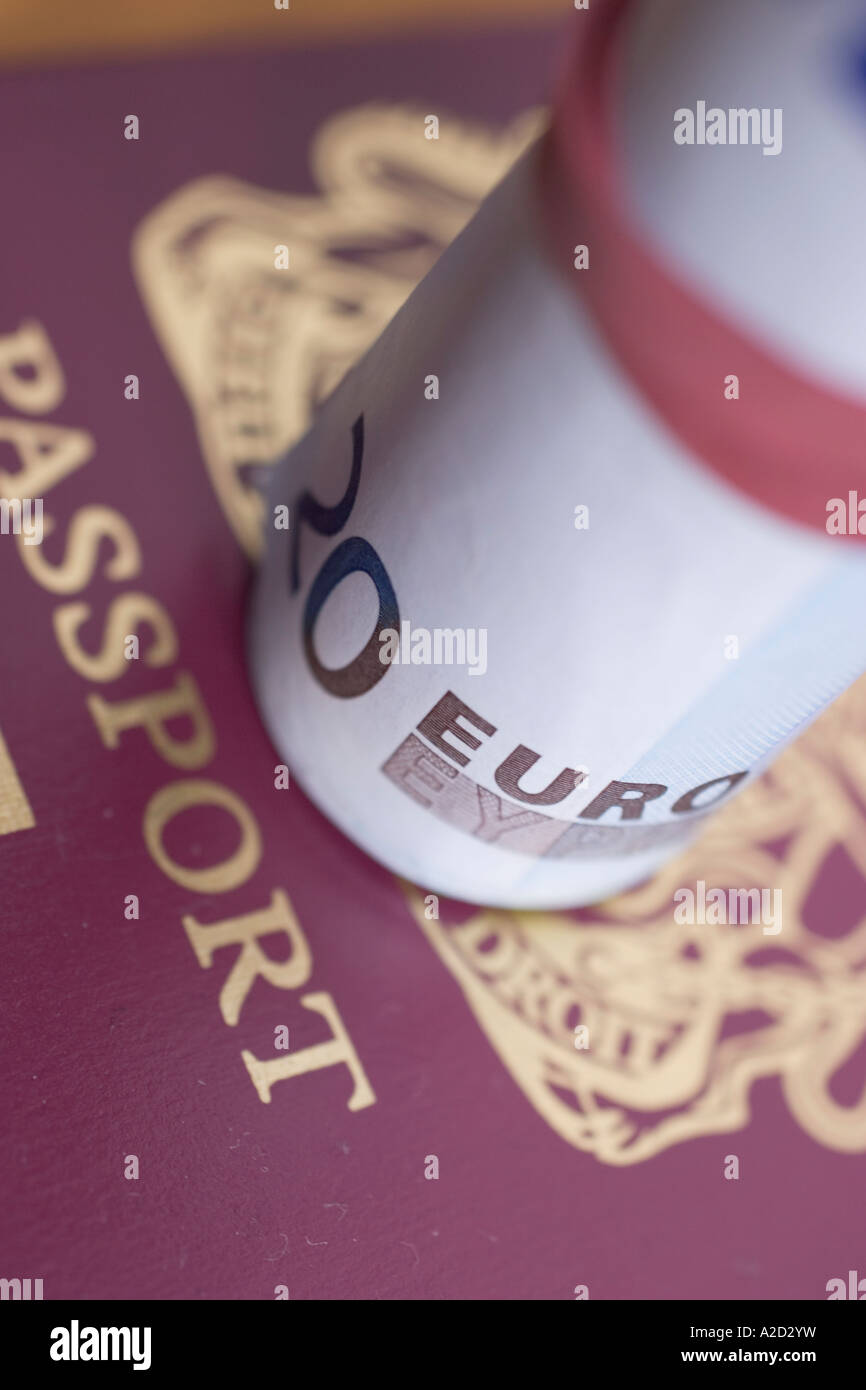 Euro notes currrency of the european community with UK british passport Stock Photo