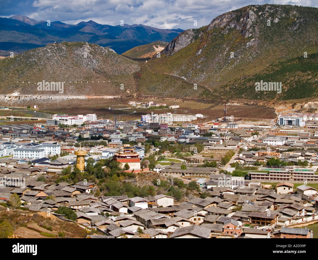aerial view of old Tibetan town and monastery giant prayer wheel Shangri La China Stock Photo