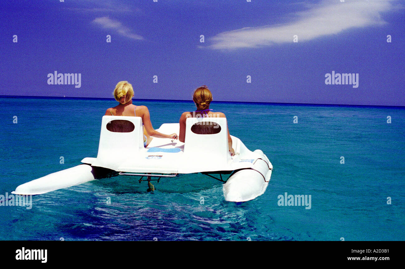 two girls on pedalo at sea Stock Photo Alamy
