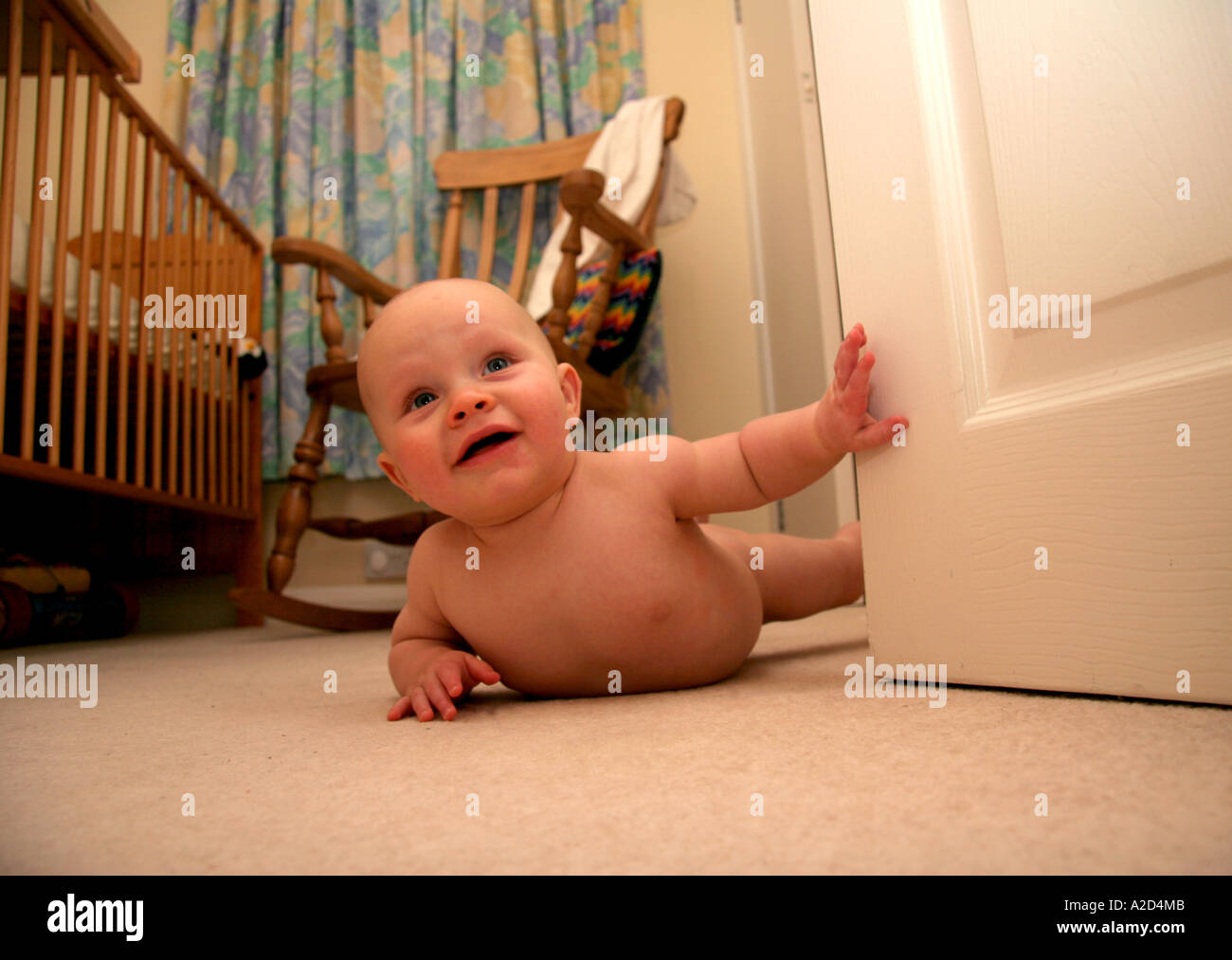 baby boy playing on floor of bedroom Stock Photo - Alamy