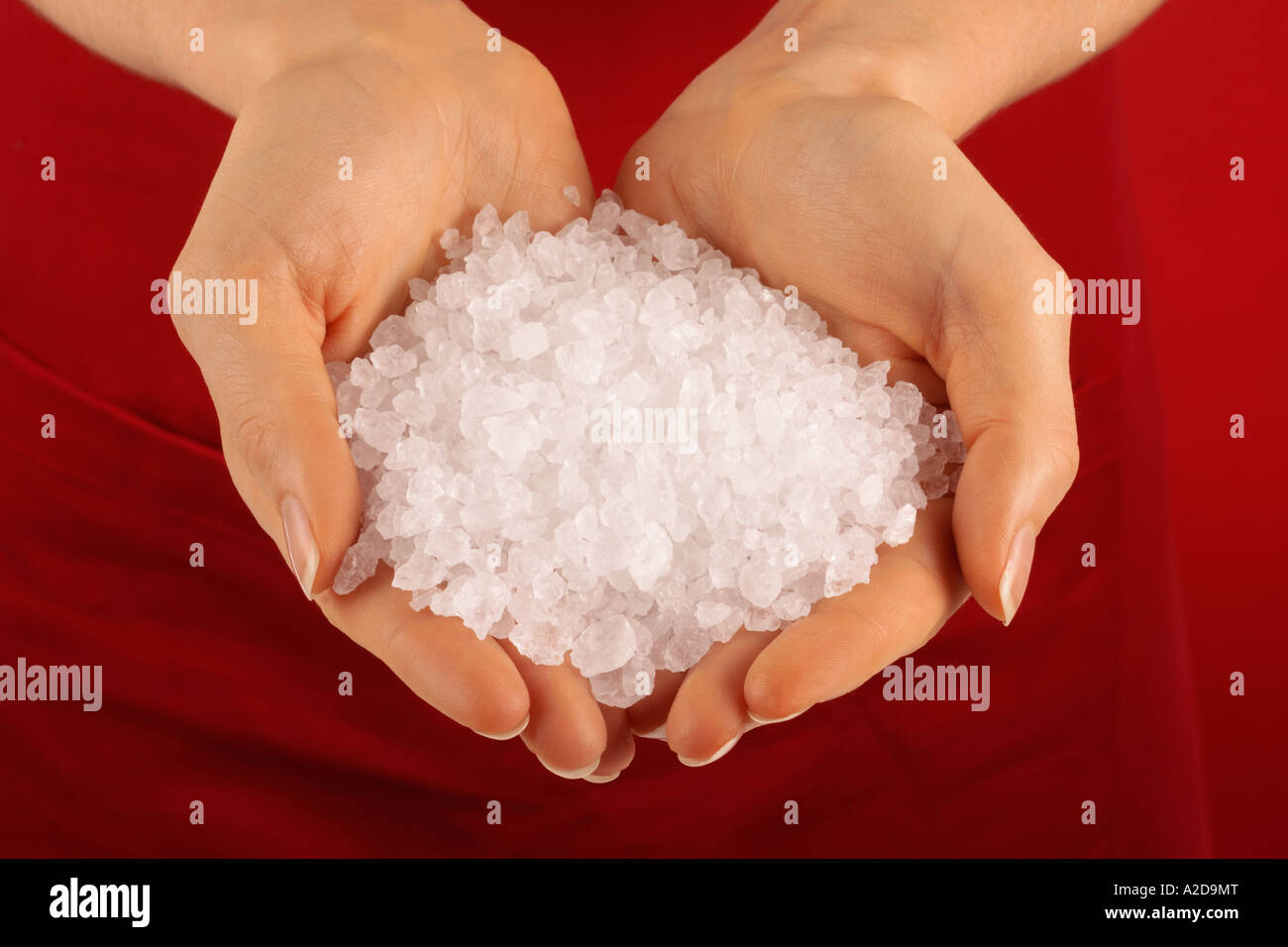 HANDFUL OF ROCK SALT Stock Photo Alamy