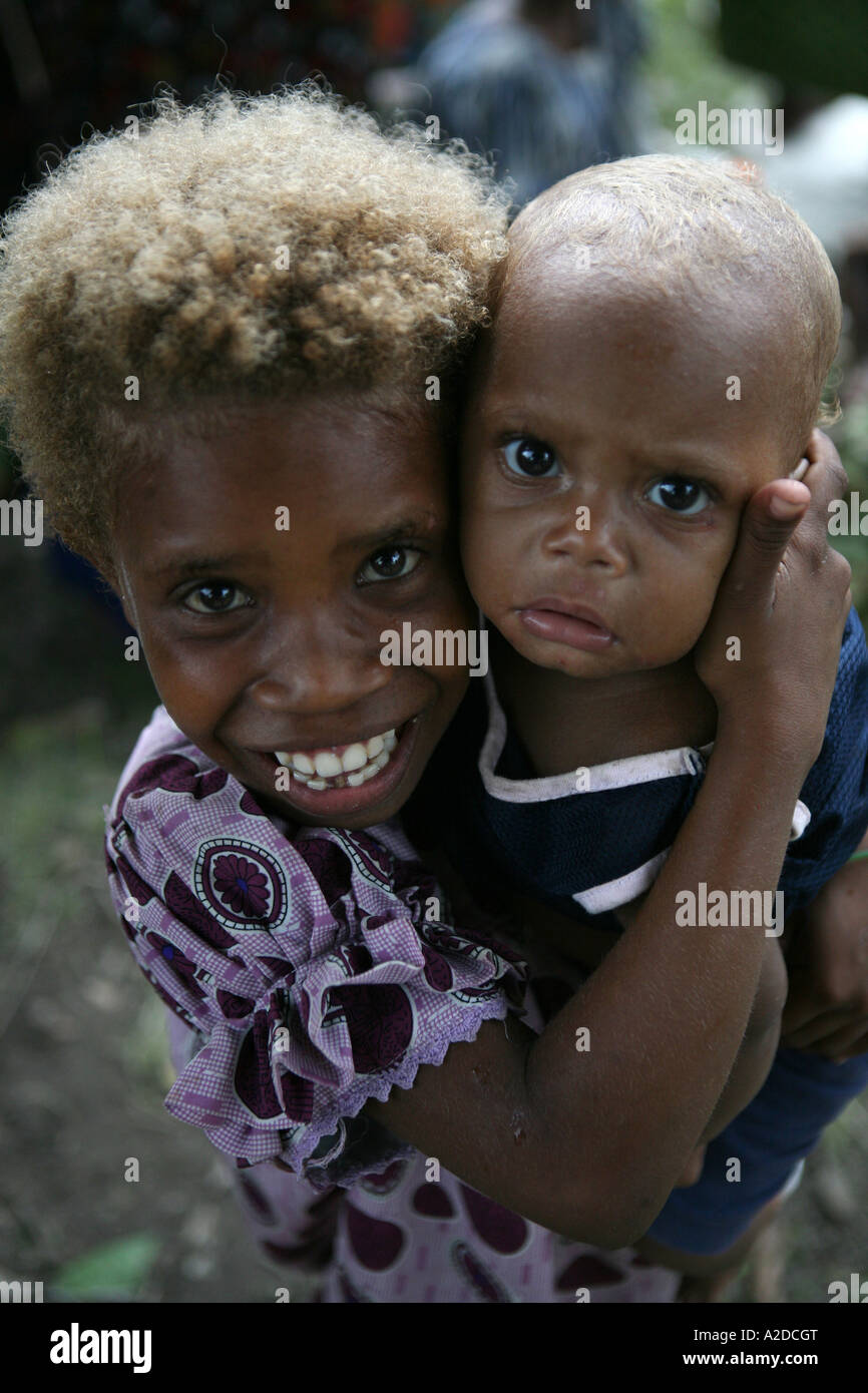 Young Tolai girl with her baby brother, Matupit Island, East New Britain, Papua New Guinea Stock Photo