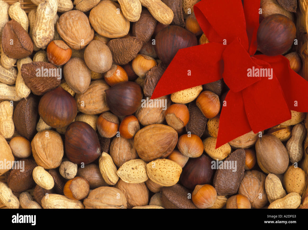 Mixed nuts with small red bow Stock Photo