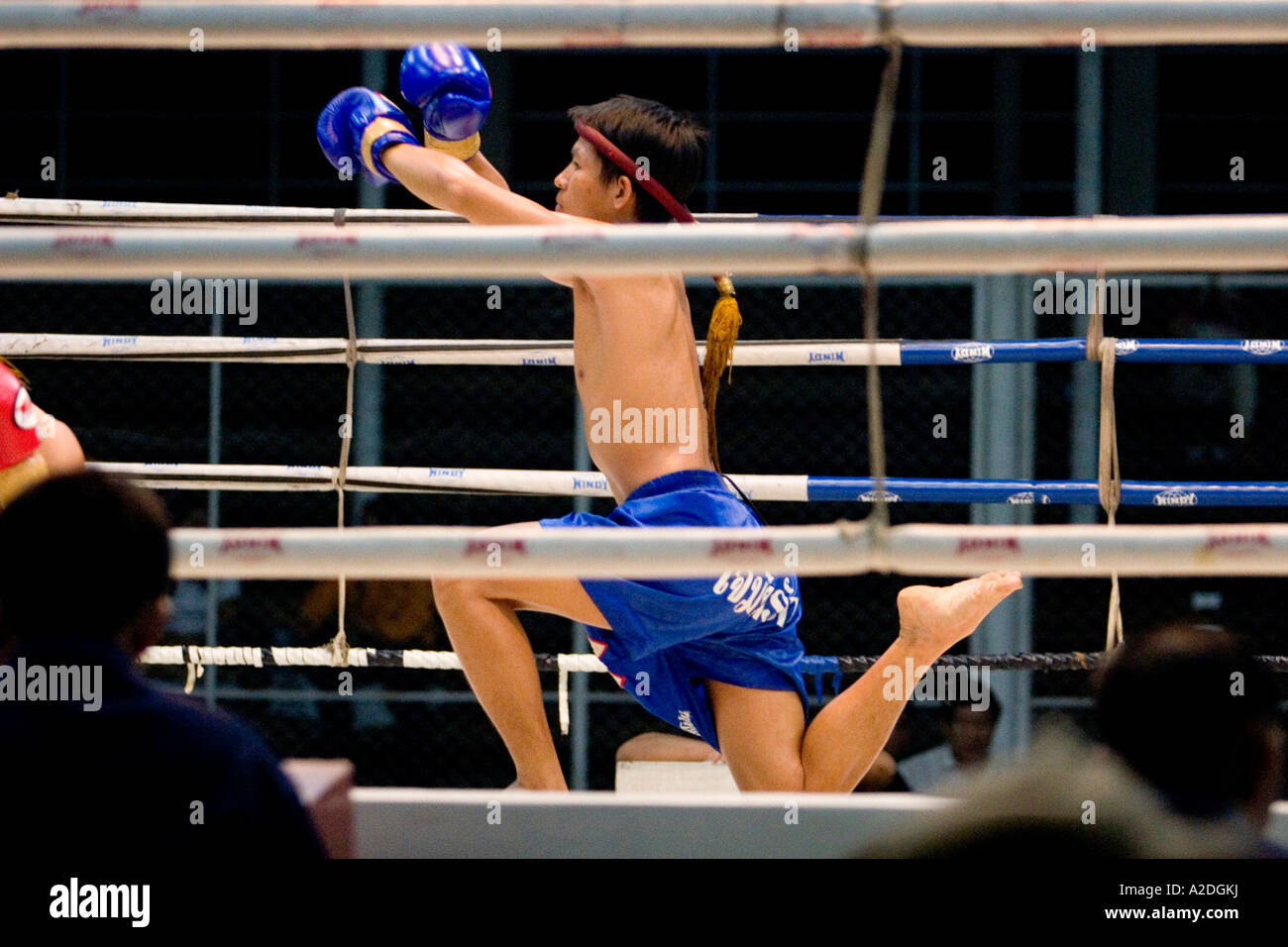 A young thai boxer goes through his pre fight ritual. Stock Photo