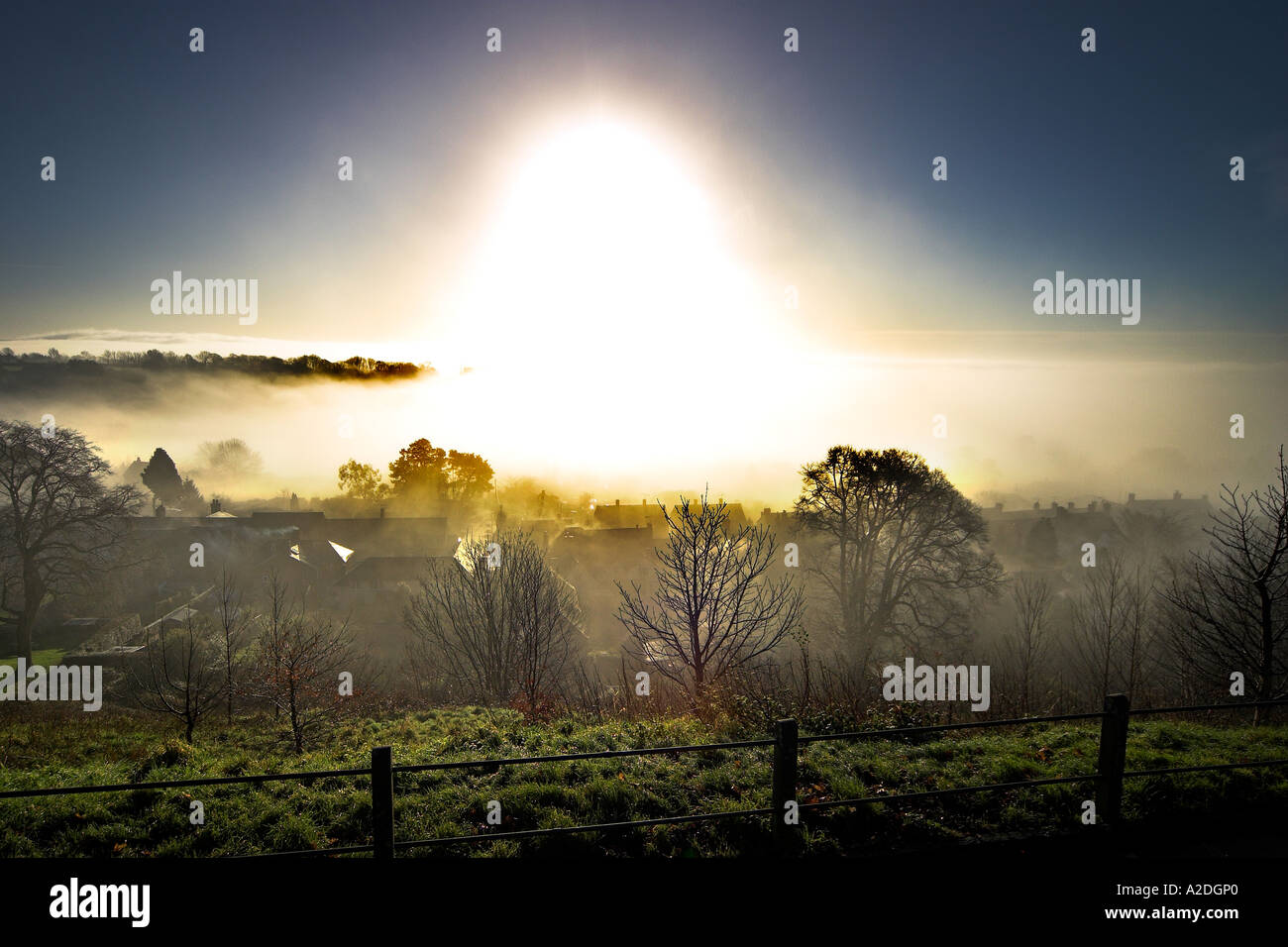 Sun Rising over Shaftesbury in the Morning Mist Stock Photo