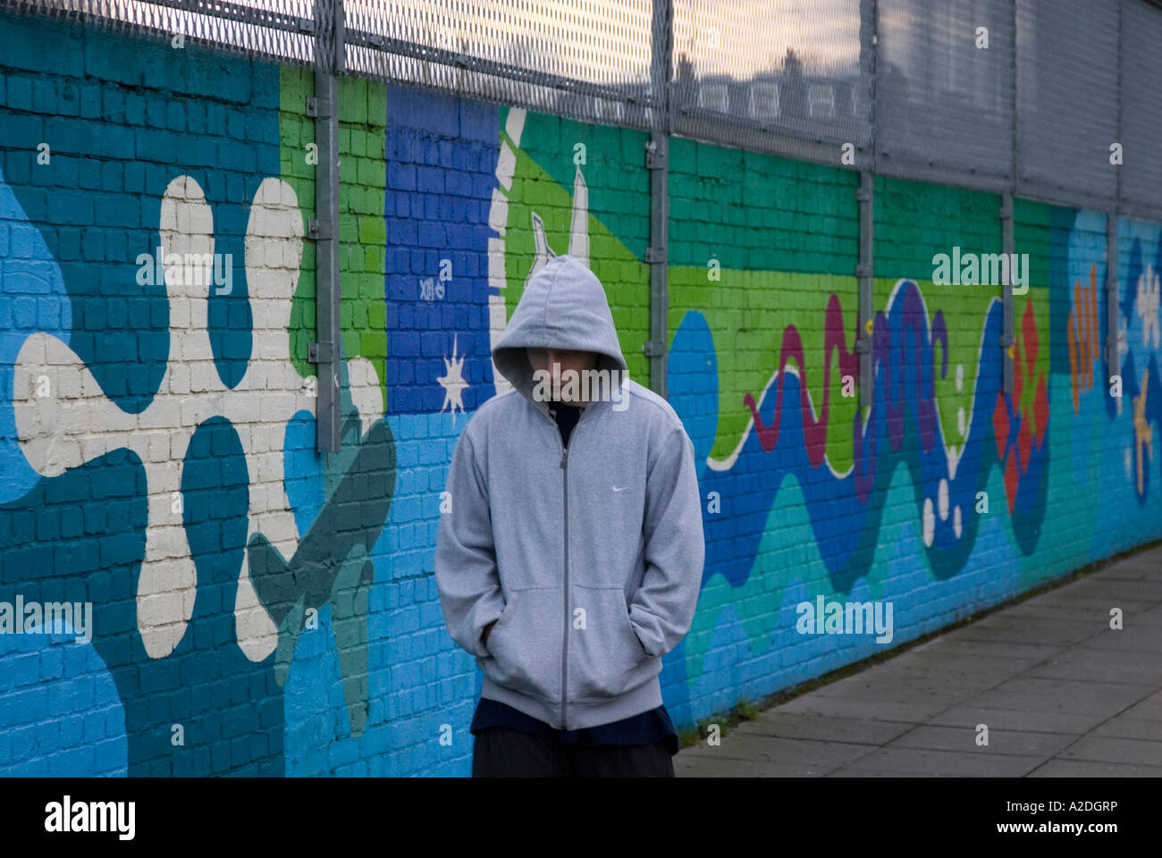 Teenager hanging around in hoodie clothing London England UK Stock Photo