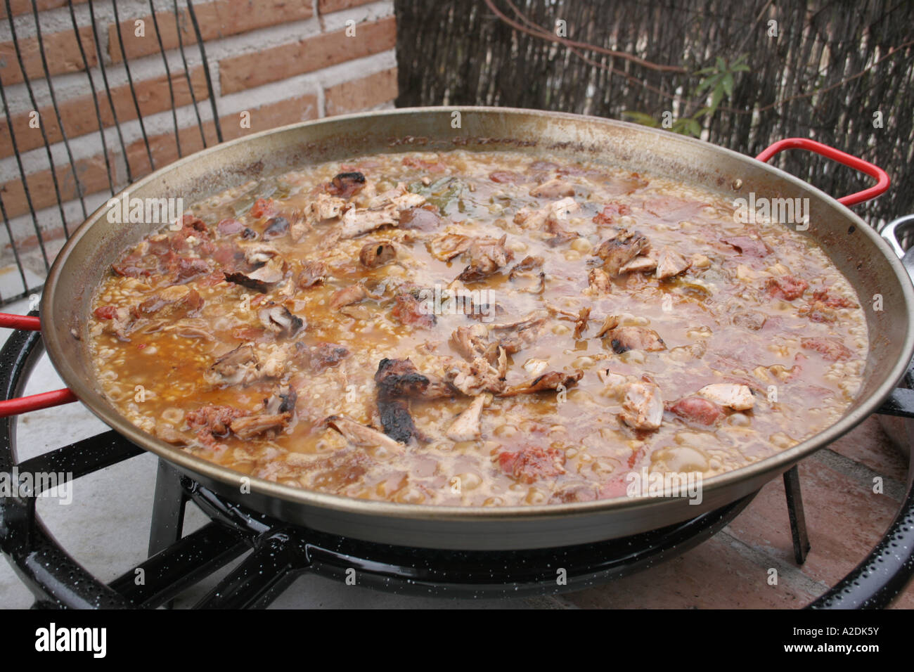 Paella being cooked outside Stock Photo Alamy