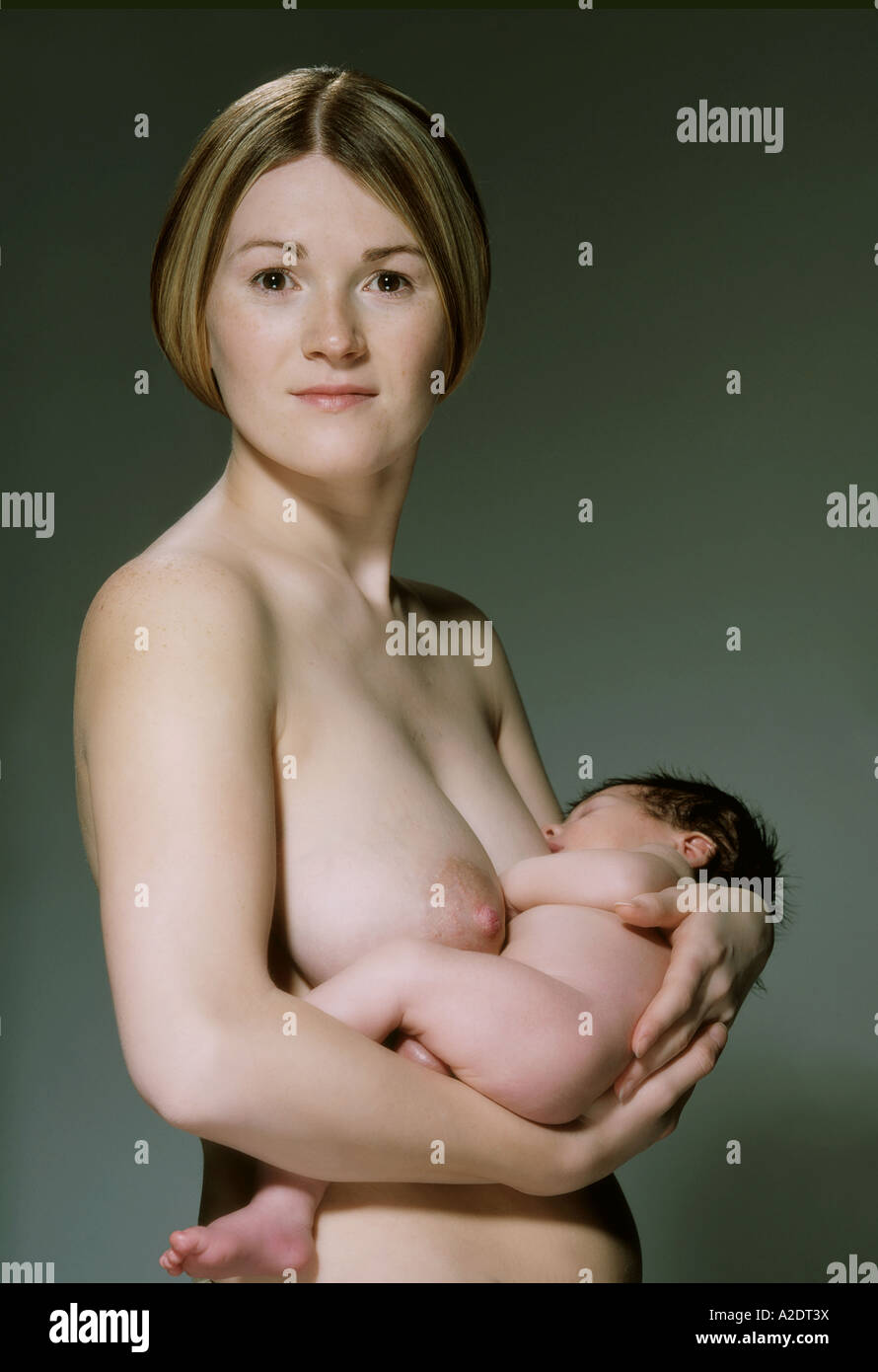 woman boy nude*** 1218321 indoor studio woman young 25 30 blonde long hair baby infant child  0 5 girl boy brunette dark haired naked nakedn Stock Photo - Alamy
