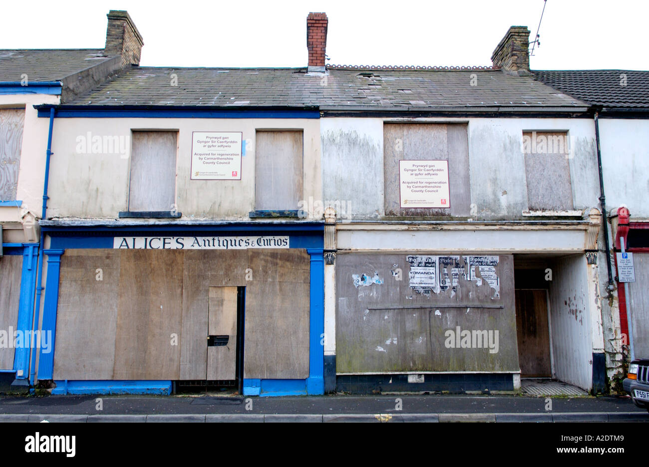 Derelict shop buildings acquired by Carmarthenshire County Council for regeneration in Llanelli town centre UK Stock Photo