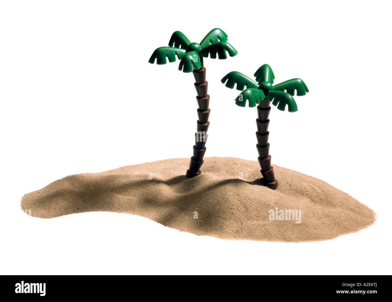 A sand desert island with two toy palm trees Stock Photo - Alamy