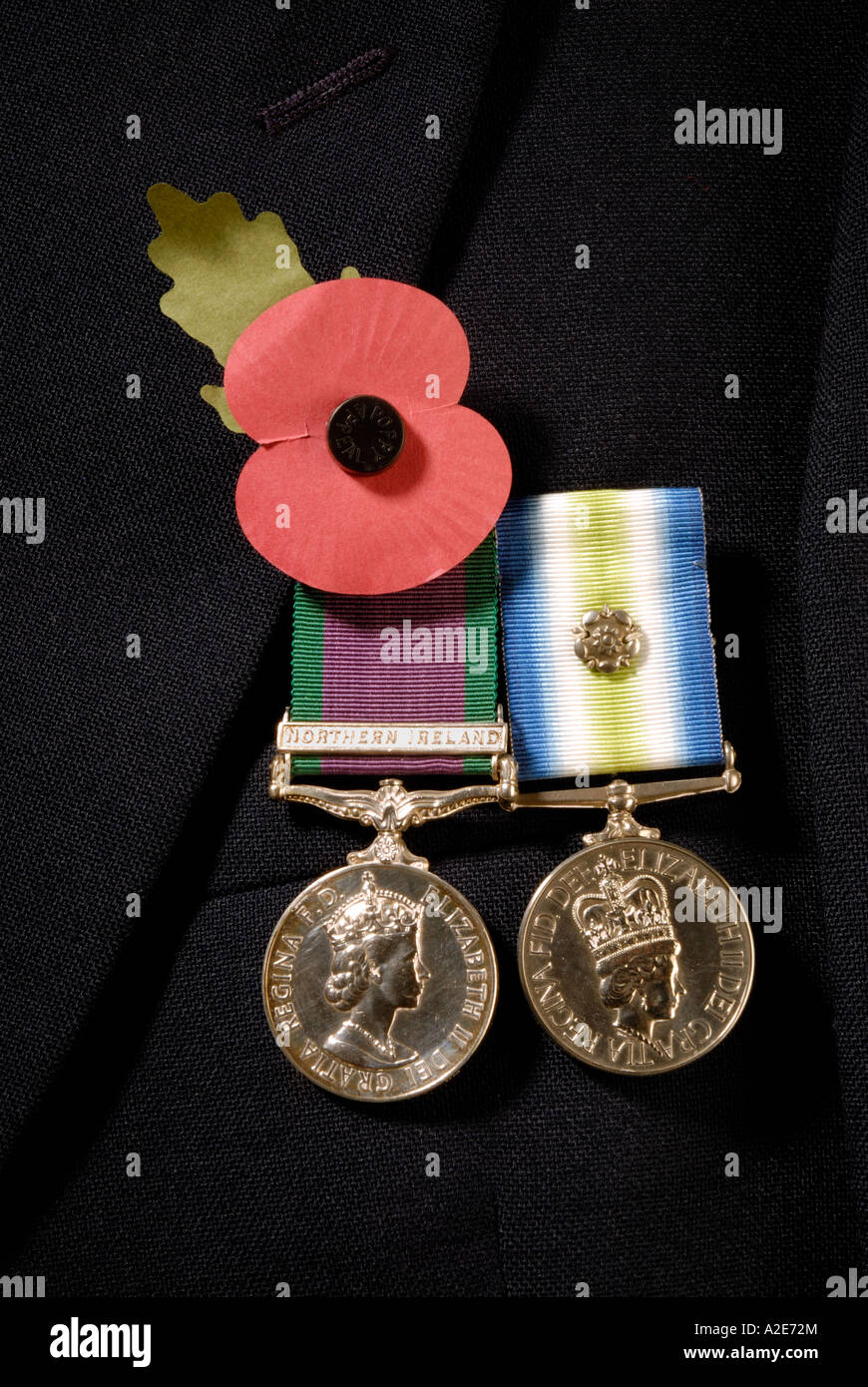 General Service medal with a Northern Ireland bar and South Atlantic medal with rosette and a poppy pinned on a blazer Stock Photo