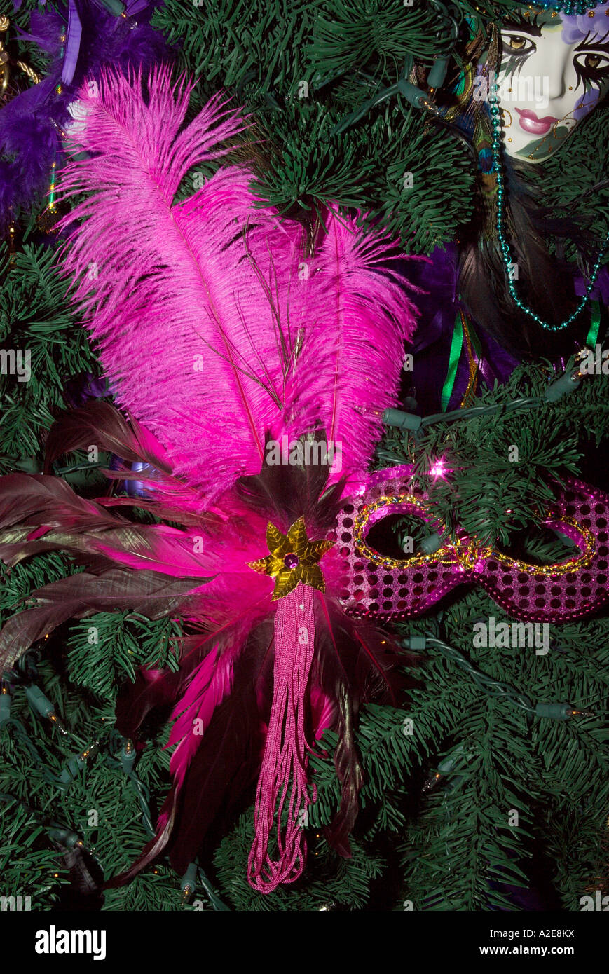 Pink feathers and masks on a Christmas tree that will be auctioned off