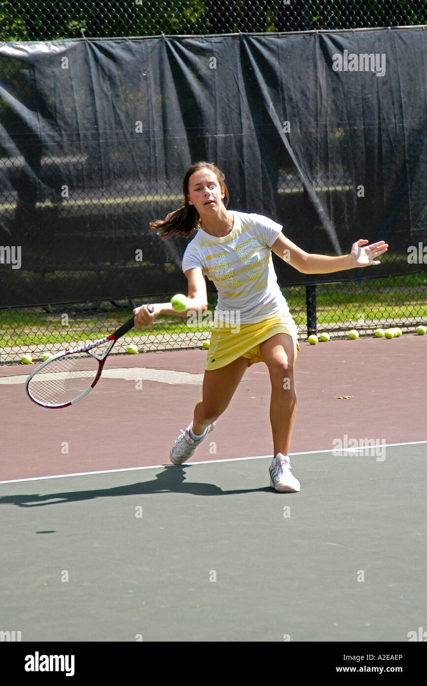 Teenage female playing at a High School tennis game in Michigan Stock