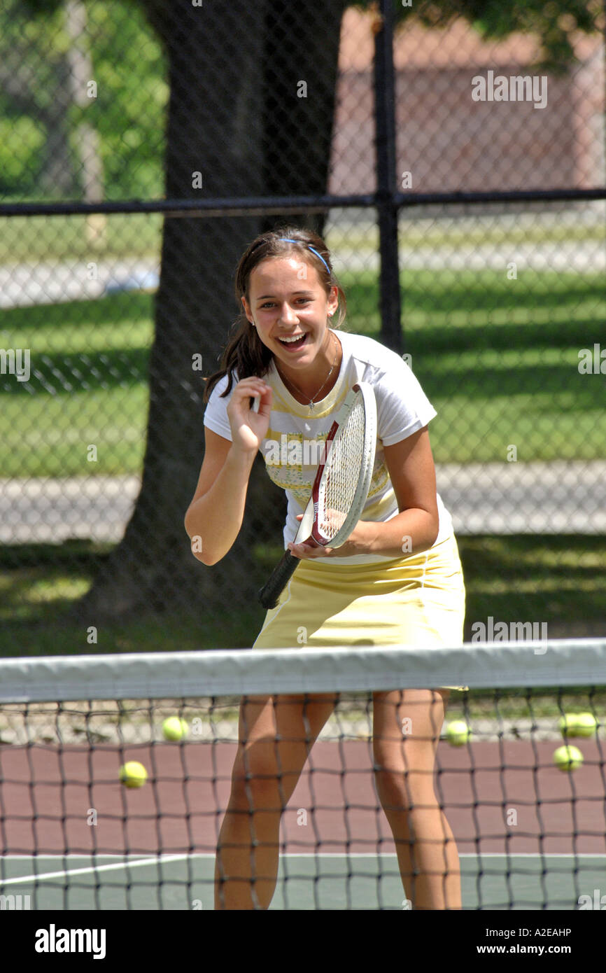 Teenage female playing at a High School tennis game in Michigan Stock