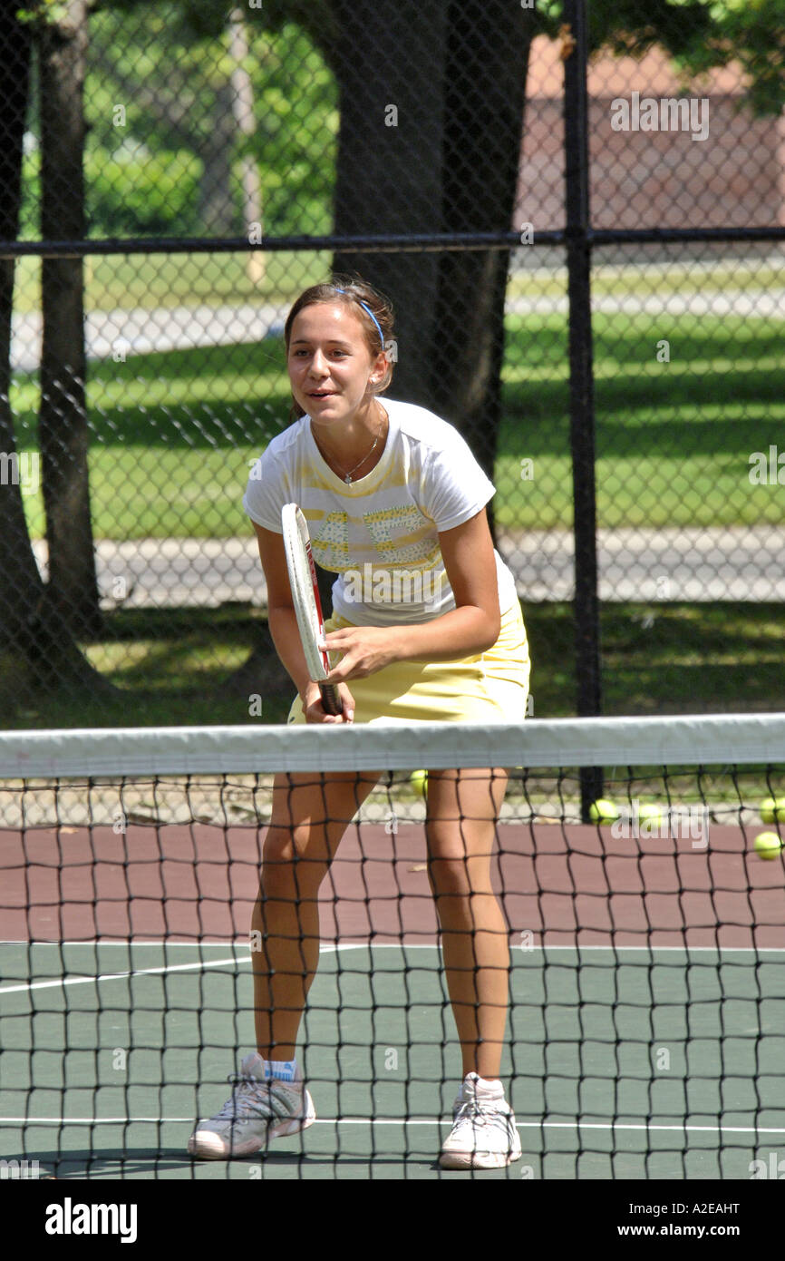 Teenage female playing at a High School tennis game in Michigan Stock