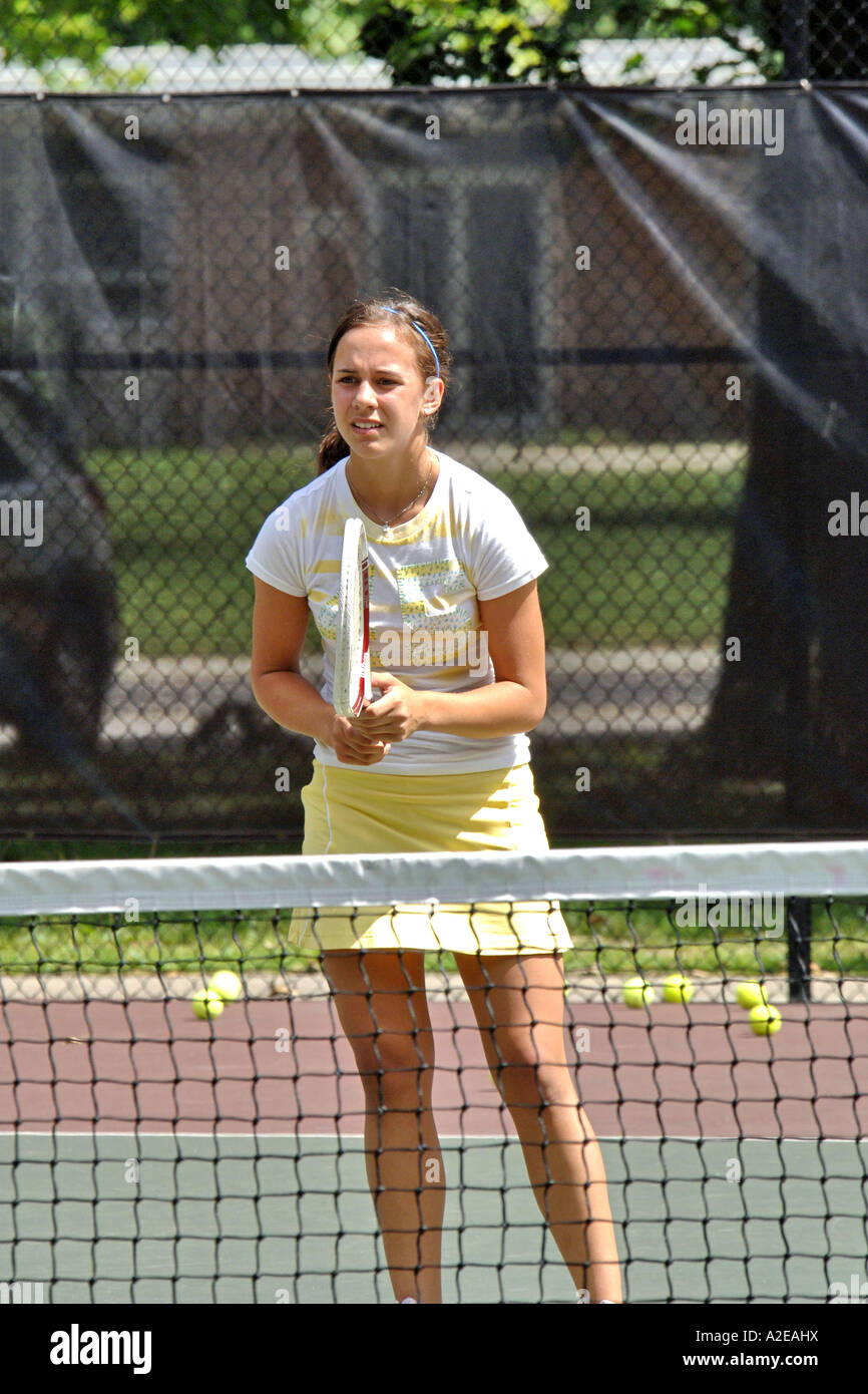 Teenage female playing at a High School tennis game in Michigan Stock
