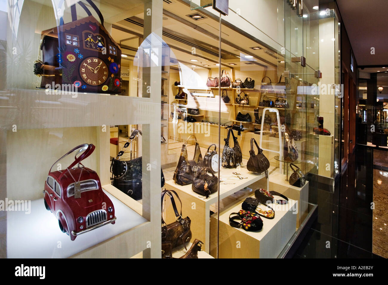 Dubai Mall of Emirates shopping mall shop window for luxery woman hand bags in form of a car or a cuckoo clock Stock Photo