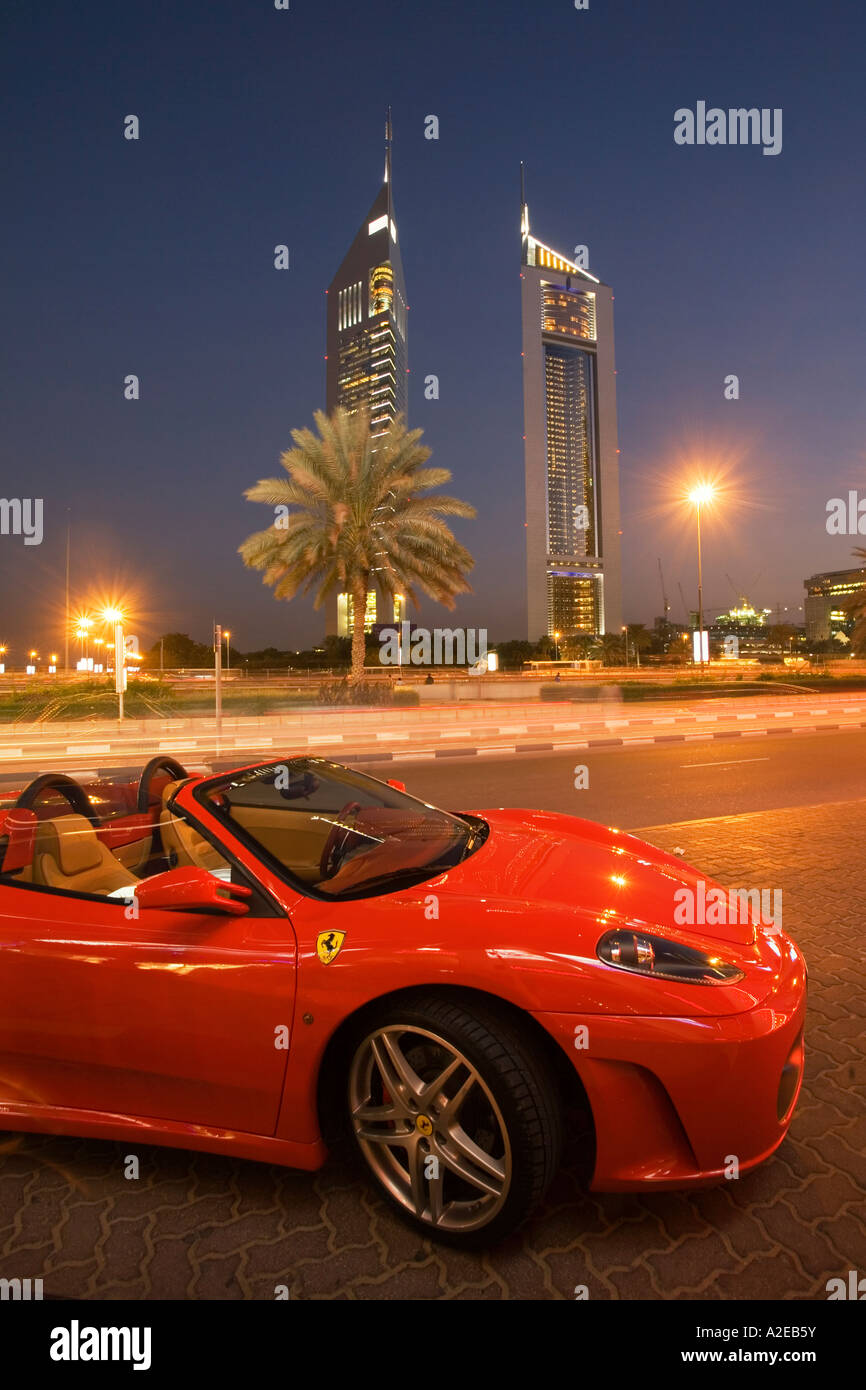Dubai Sheikh Zayed Road skyscraper Emirates towers skyline Ferrari Stock Photo