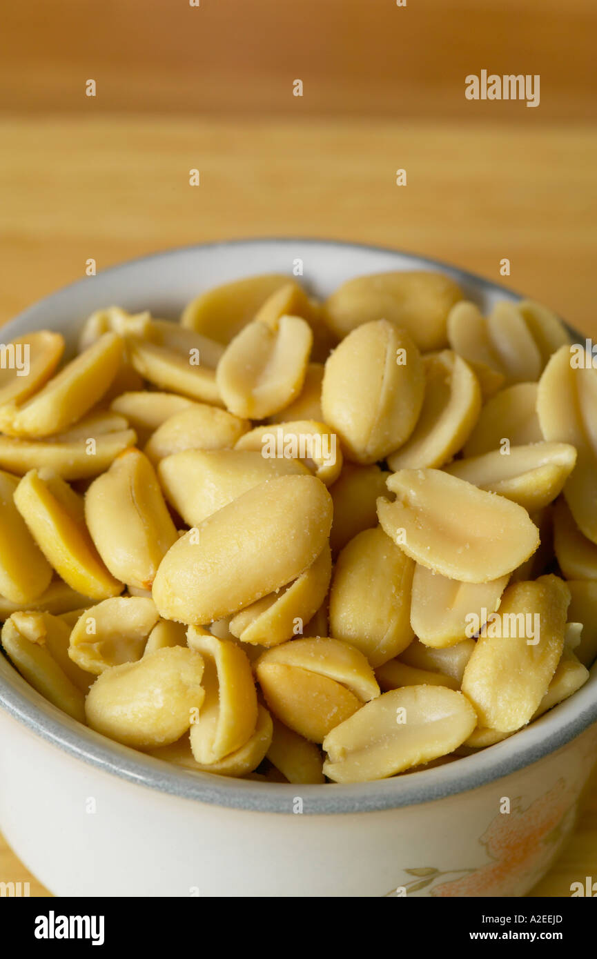 salted peanuts in a white bowl Stock Photo