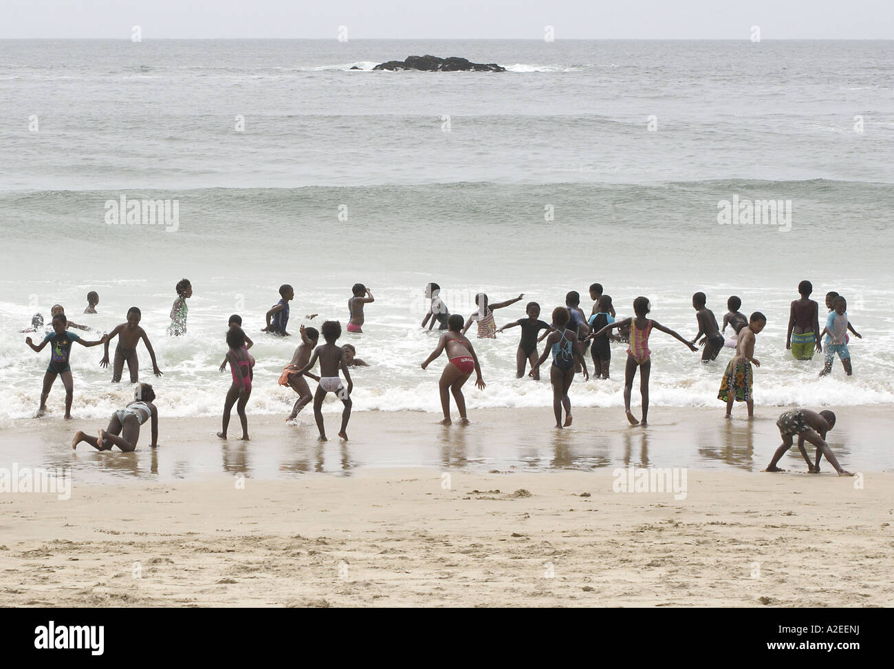 South African School Children Playing in the Waves Stock Photo