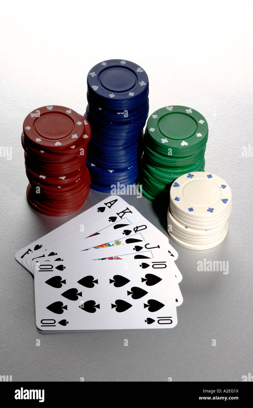 Poker chips and Royal Flush playing cards Stock Photo