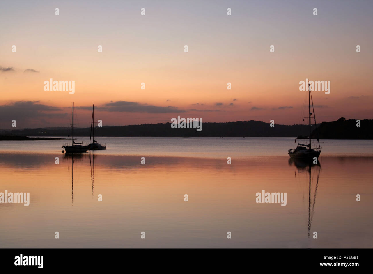 Boats in the evening sun at the shore Alvor Algarve Portugal Stock Photo