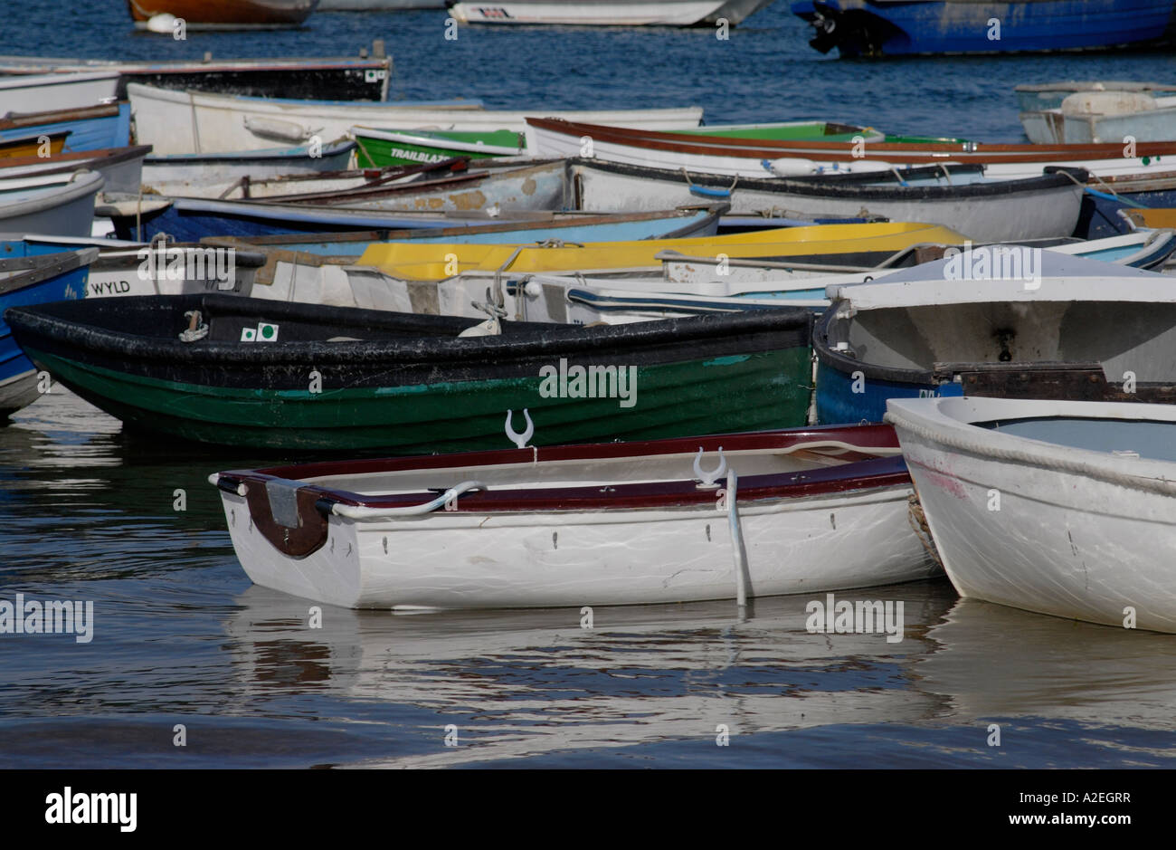 Multi coloured rowing boats tied up in Chichester Harbour West Itchenor ...