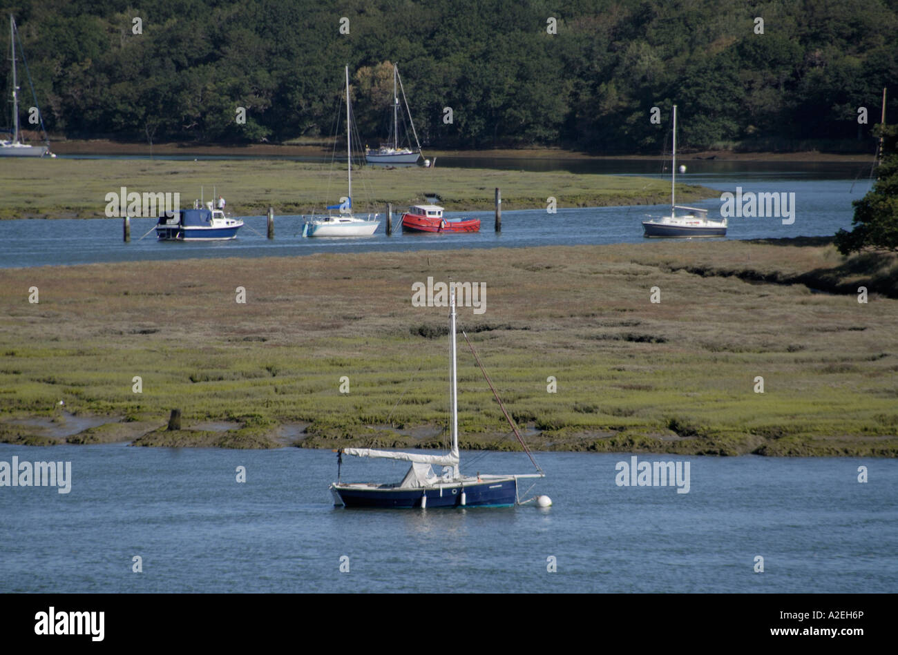 Sailing boats moored in the tidal reaches of the Beaulieu River Stock Photo