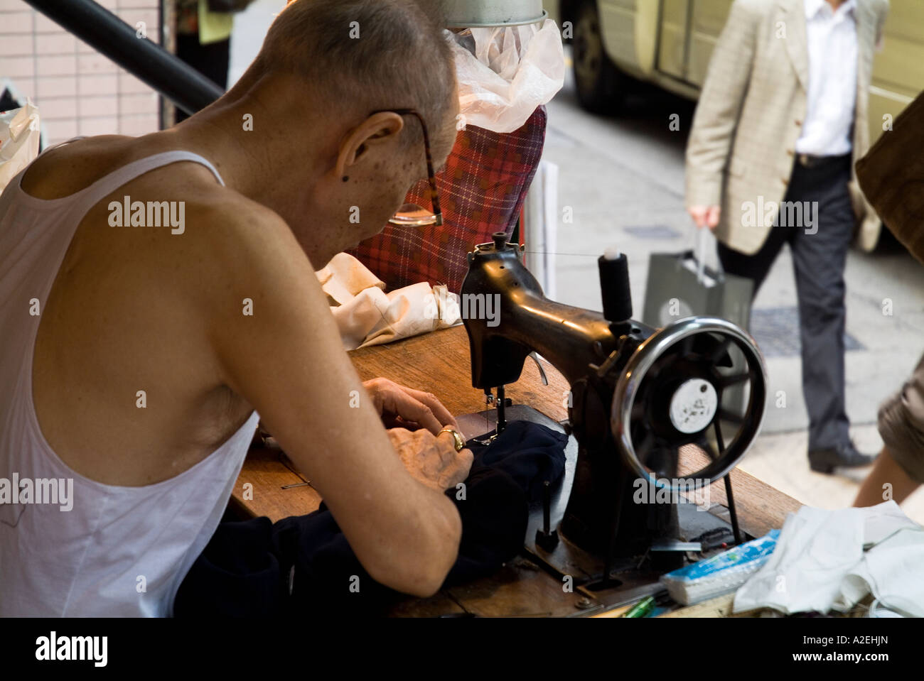dh Pottinger Street CENTRAL HONG KONG Old chinese man mending clothes
