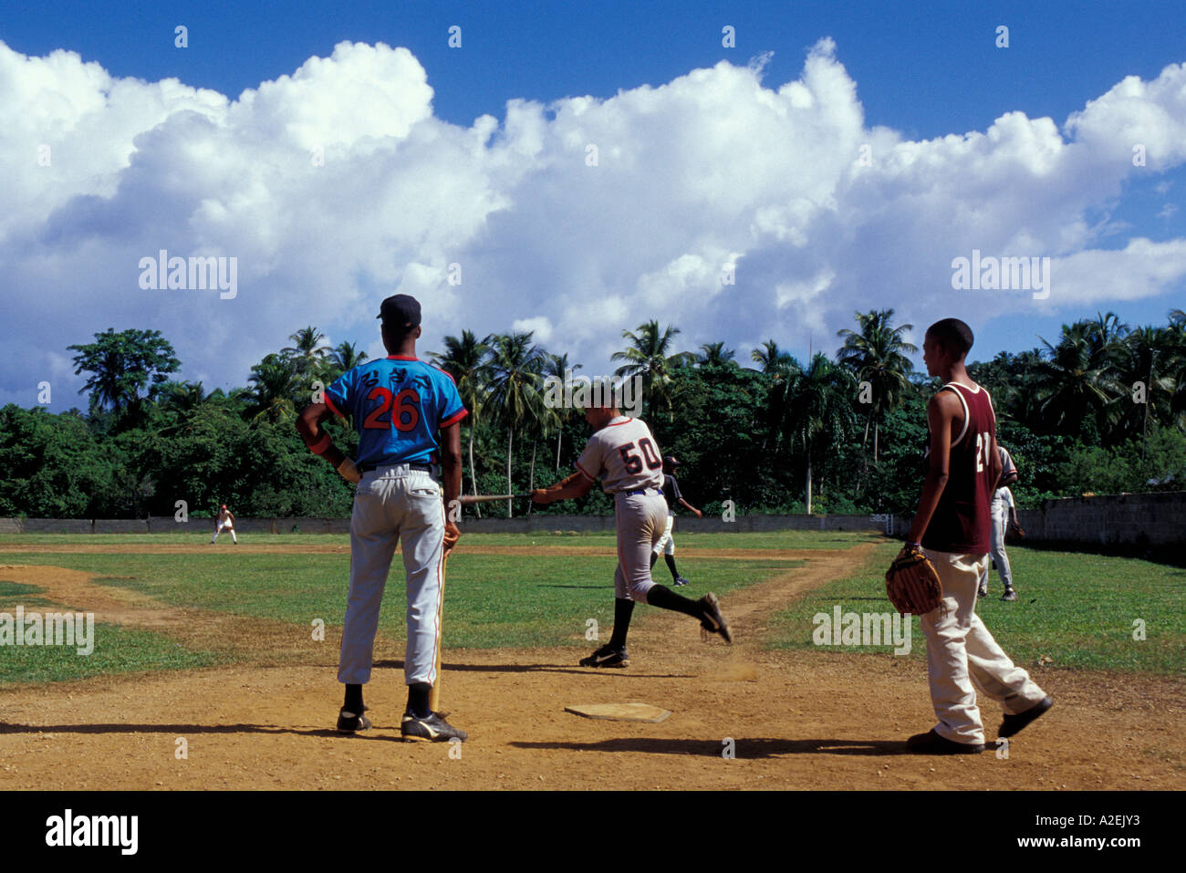 Dominican Republic, Samana Peninsula.  Young men playing baseball. Stock Photo